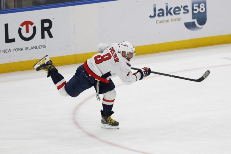 Washington Capitals left wing Alex Ovechkin (8) scores a goal against the New York Islanders in the second period at UBS Arena. It was the 895th goal of his career, breaking the record for most NHL all-time goals set by Wayne Gretzky (not pictured).