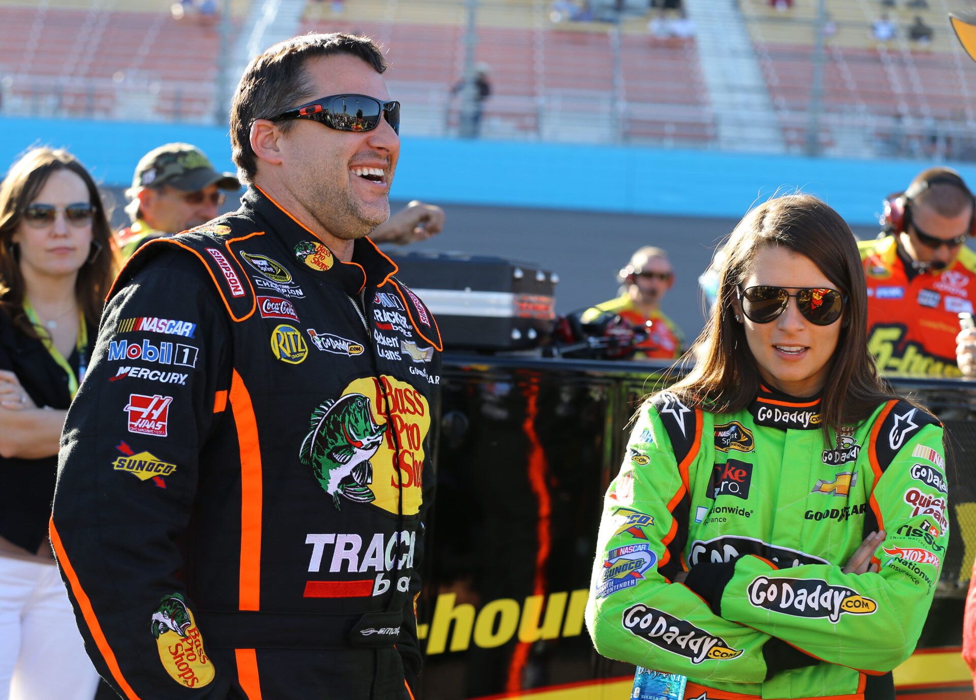 Mar. 1, 2013; Avondale, AZ, USA; NASCAR Sprint Cup Series driver Tony Stewart (left) talks to teammate Danica Patrick during qualifying for the Subway Fresh Fit 500 at Phoenix International Raceway. Mandatory Credit: Mark J. Rebilas-USA TODAY Sports