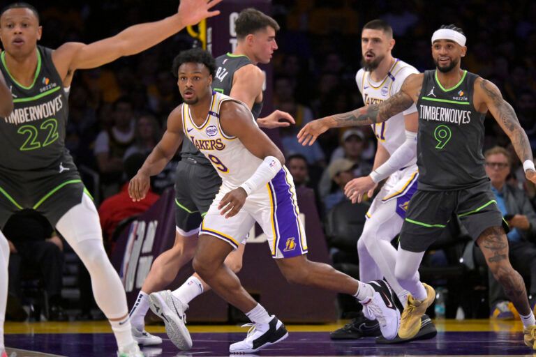 Apr 19, 2025; Los Angeles, California, USA; Los Angeles Lakers guard Bronny James (9) defends on the court in the second half against the Minnesota Timberwolves at Crypto.com Arena. Mandatory Credit: Jayne Kamin-Oncea-Imagn Images