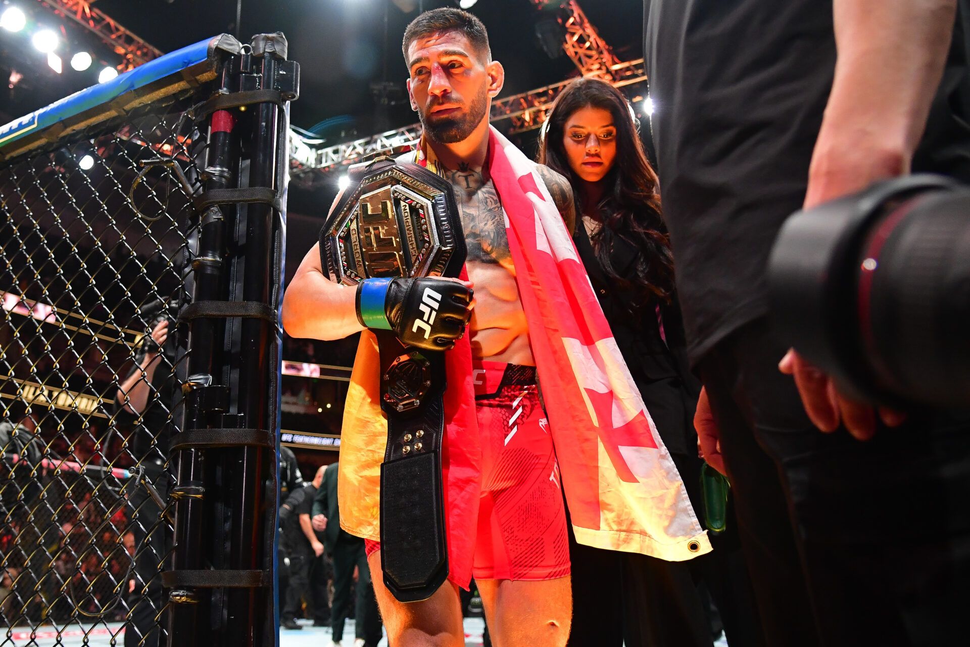 Feb 17, 2024; Anaheim, California, USA; Ilia Topuria celebrates his championship victory against Alexander Volkanovski during UFC 298 at Honda Center. Mandatory Credit: Gary A. Vasquez-USA TODAY Sports