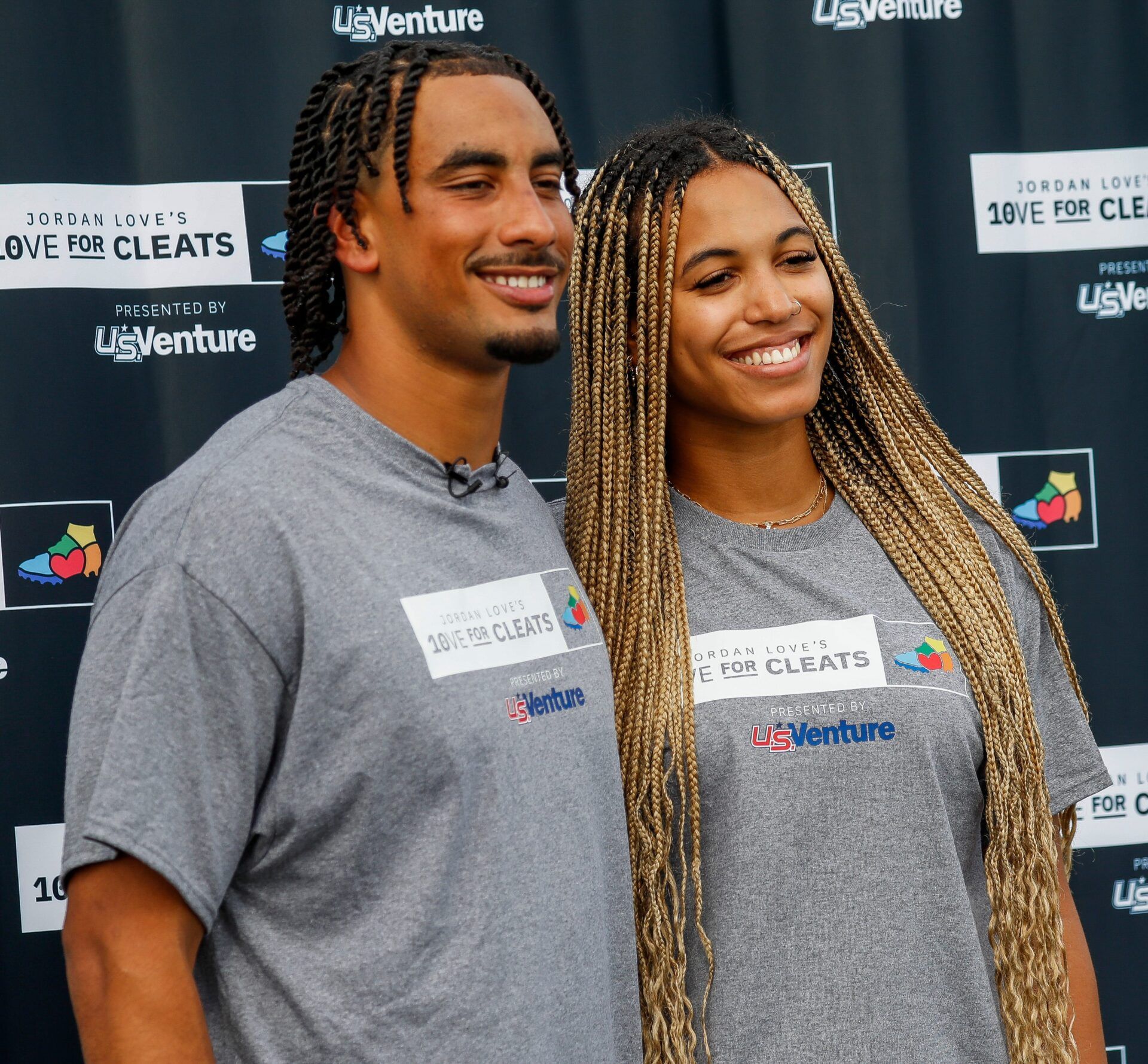Green Bay Packers quarterback Jordan Love and his fiancée, Ronika Stone, pose for a photo on Monday, August 26, 2024, at Green Bay West High School in Green Bay, Wis. Love’s foundation, Hands of 10ve, is partnering with U.S. Venture to give youth football teams a set of new cleats for each touchdown Love runs or throws for in the 2024 season. Teams will be able to apply for cleats in December, and cleats will be given to teams based on need. Tork Mason/USA TODAY NETWORK-Wisconsin