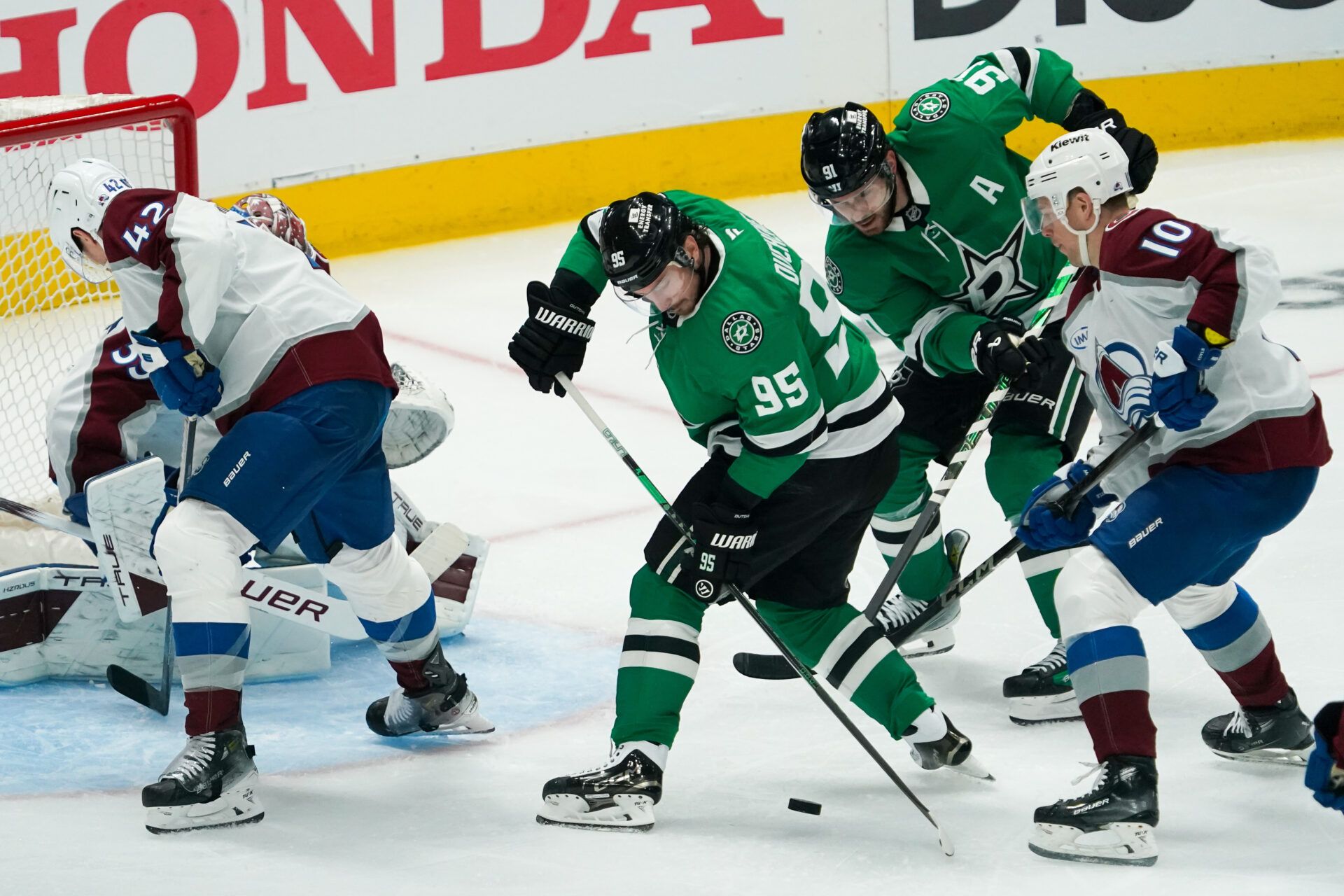 Apr 19, 2025; Dallas, Texas, USA; Dallas Stars center Matt Duchene (95) looks to shoot the puck as Colorado Avalanche center Charlie Coyle (10) defends during the third period in game one of the first round of the 2025 Stanley Cup Playoffs at American Airlines Center. Mandatory Credit: Raymond Carlin III-Imagn Images
