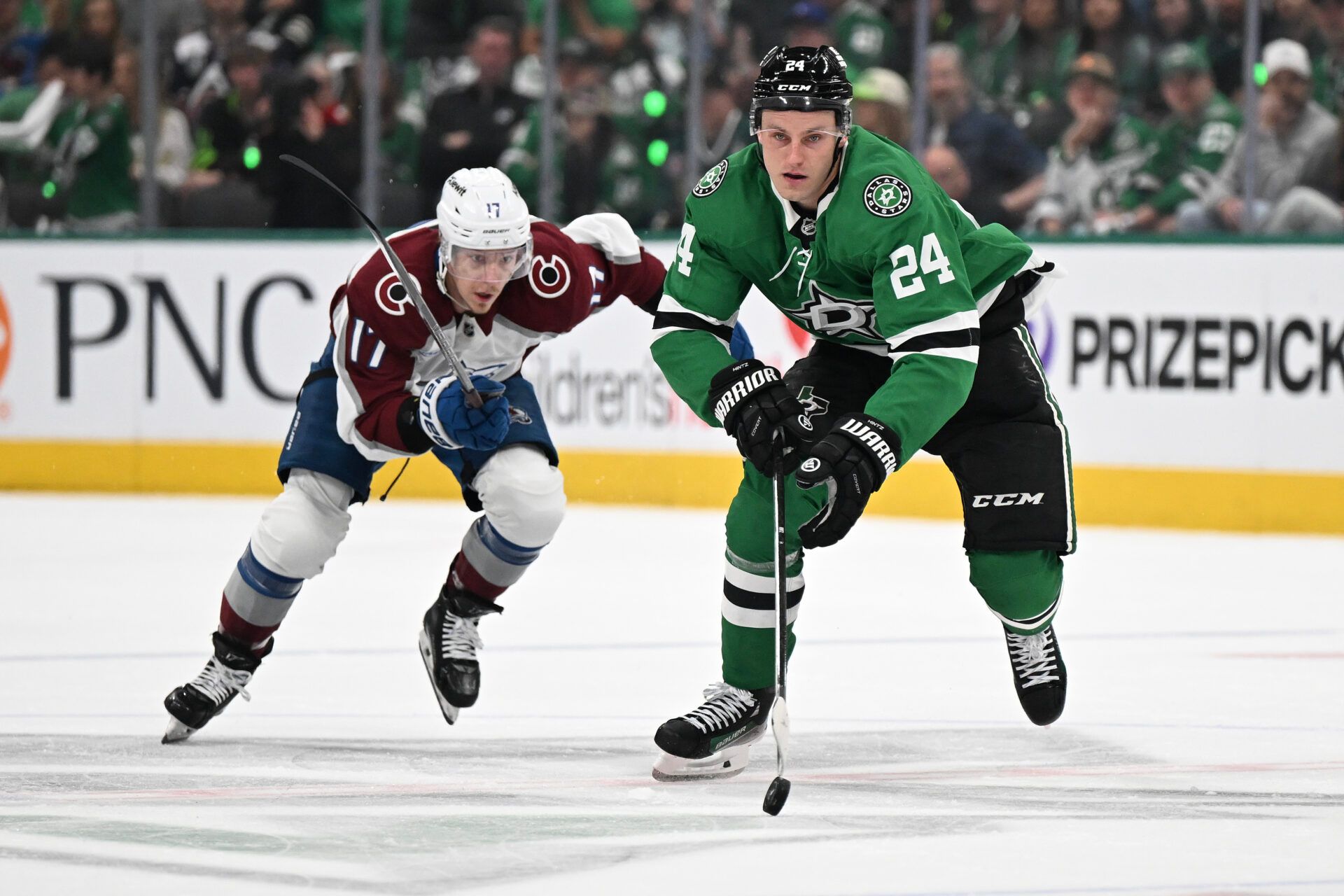 DALLAS, TEXAS - APRIL 19: Roope Hintz #24 of the Dallas Stars skates against Parker Kelly #17 of the Colorado Avalanche in the first period of Game One of the First Round of the 2025 Stanley Cup Playoffs at American Airlines Center on April 19, 2025 in Dallas, Texas. (Photo by Jack Gorman/Getty Images)