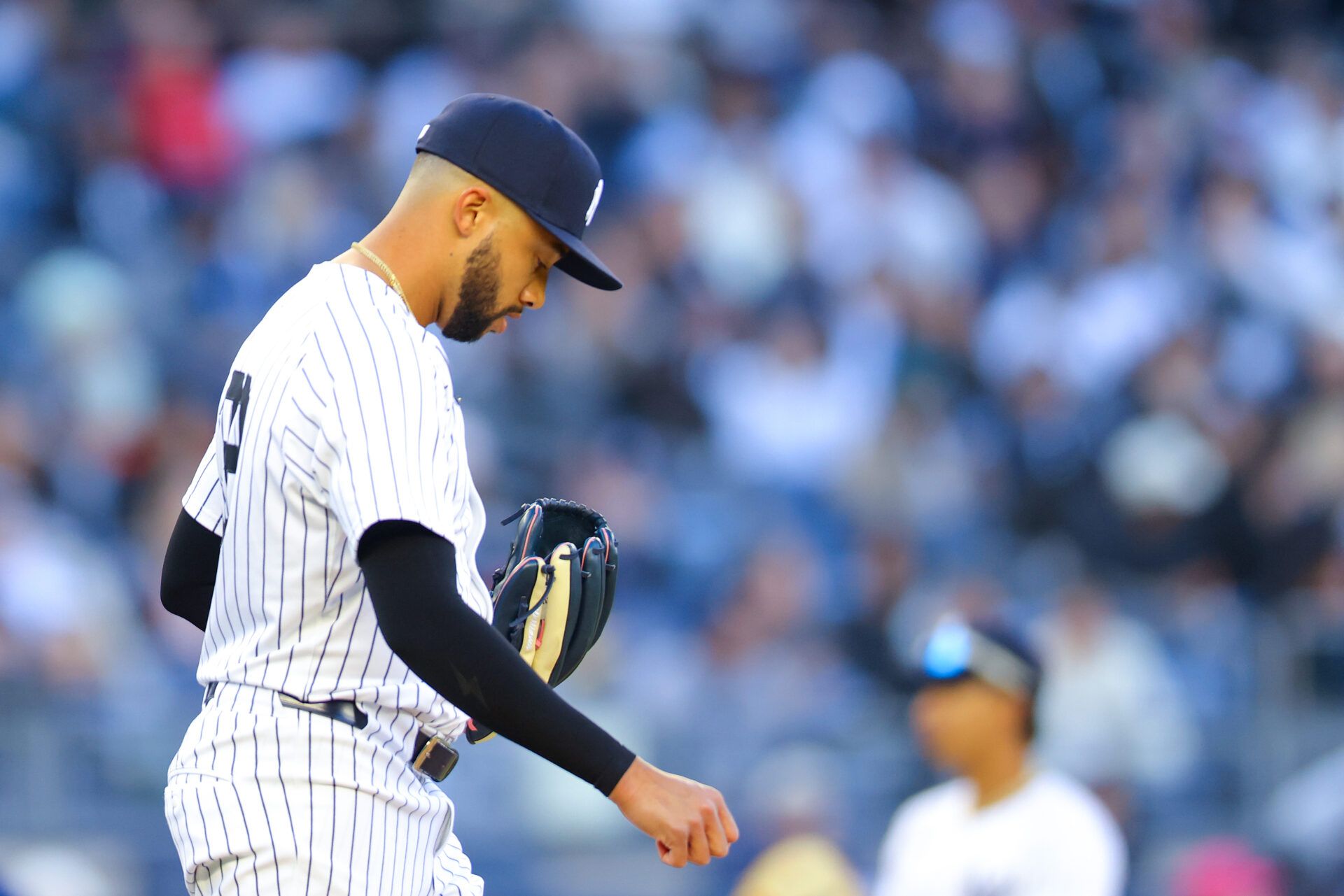 NEW YORK, NEW YORK - MARCH 27: Devin Williams #38 of the New York Yankees reacts after a walk in the ninth inning against the Milwaukee Brewers on Opening Day at Yankee Stadium on March 27, 2025 in New York City. (Photo by Mike Stobe/Getty Images)