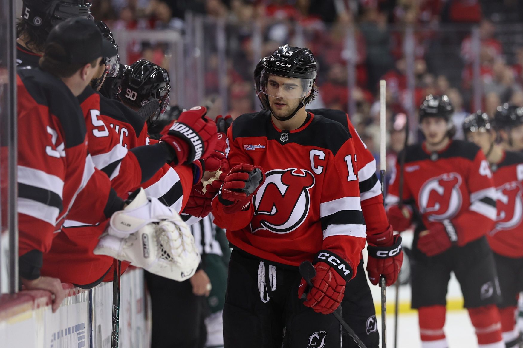 New Jersey Devils center Nico Hischier (13) celebrates his goal against the Minnesota Wild during the third period at Prudential Center.