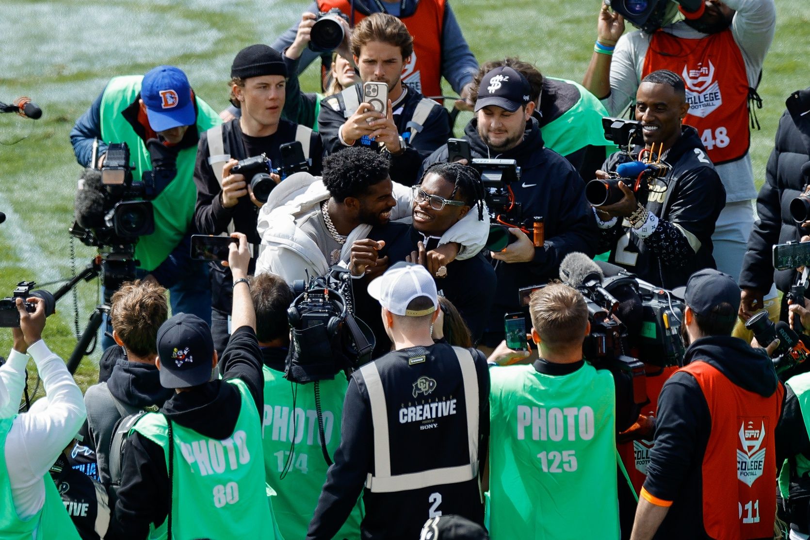 Former Colorado Buffaloes players Shedeur Sanders (L) and Travis Hunter (R) during their number retirement ceremony before the spring game at Folsom Field.