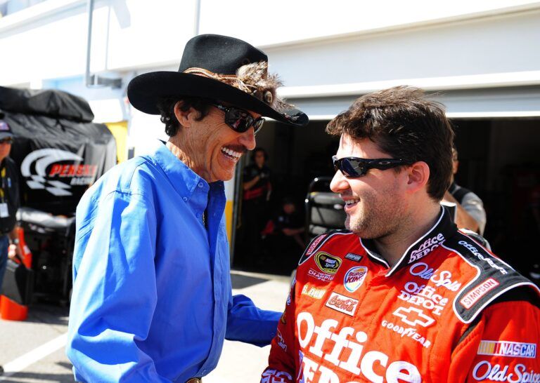 NASCAR Sprint Cup Series driver Tony Stewart (right) talks with Richard Petty during practice for the Daytona 500 at Daytona International Speedway.