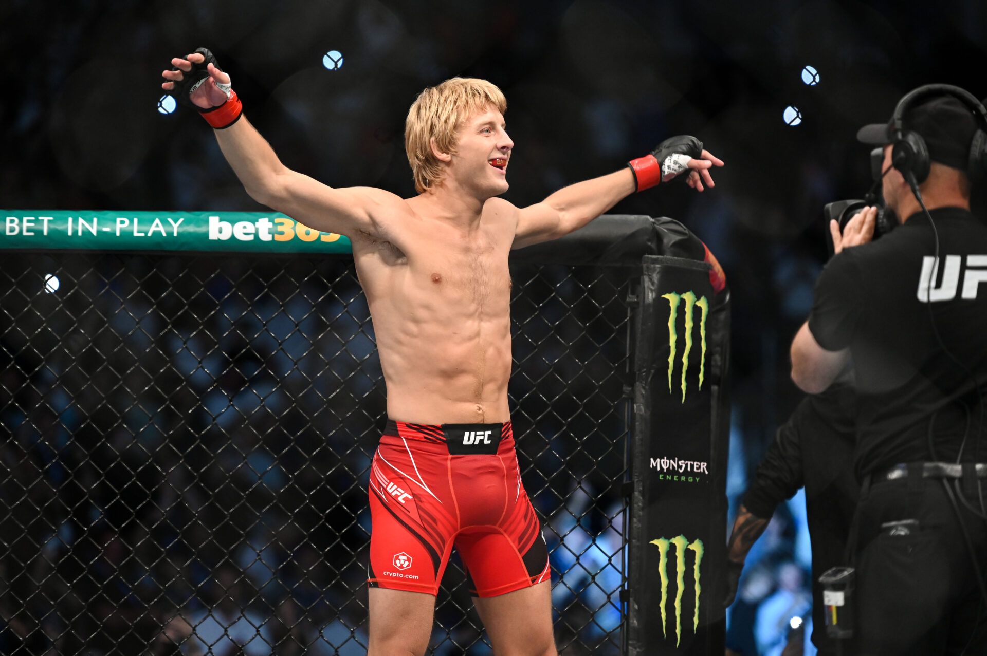 Jul 23, 2022; London, United Kingdom; Paddy Pimblett (red gloves) is introduced before fighting Jordan Leavitt (blue gloves) during UFC Fight Night at O2 Arena. Mandatory Credit: Per Haljestam-USA TODAY Sports