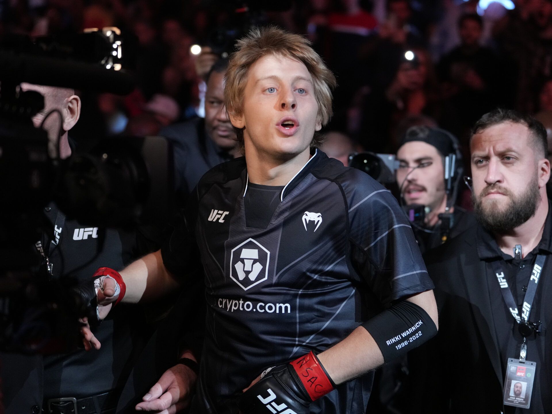 Dec 10, 2022; Las Vegas, Nevada, USA; Paddy Pimblett (red gloves) enters the arena before the fight against Jared Gordon (blue gloves) during UFC 282 at T-Mobile Arena. Mandatory Credit: Stephen R. Sylvanie-USA TODAY Sports