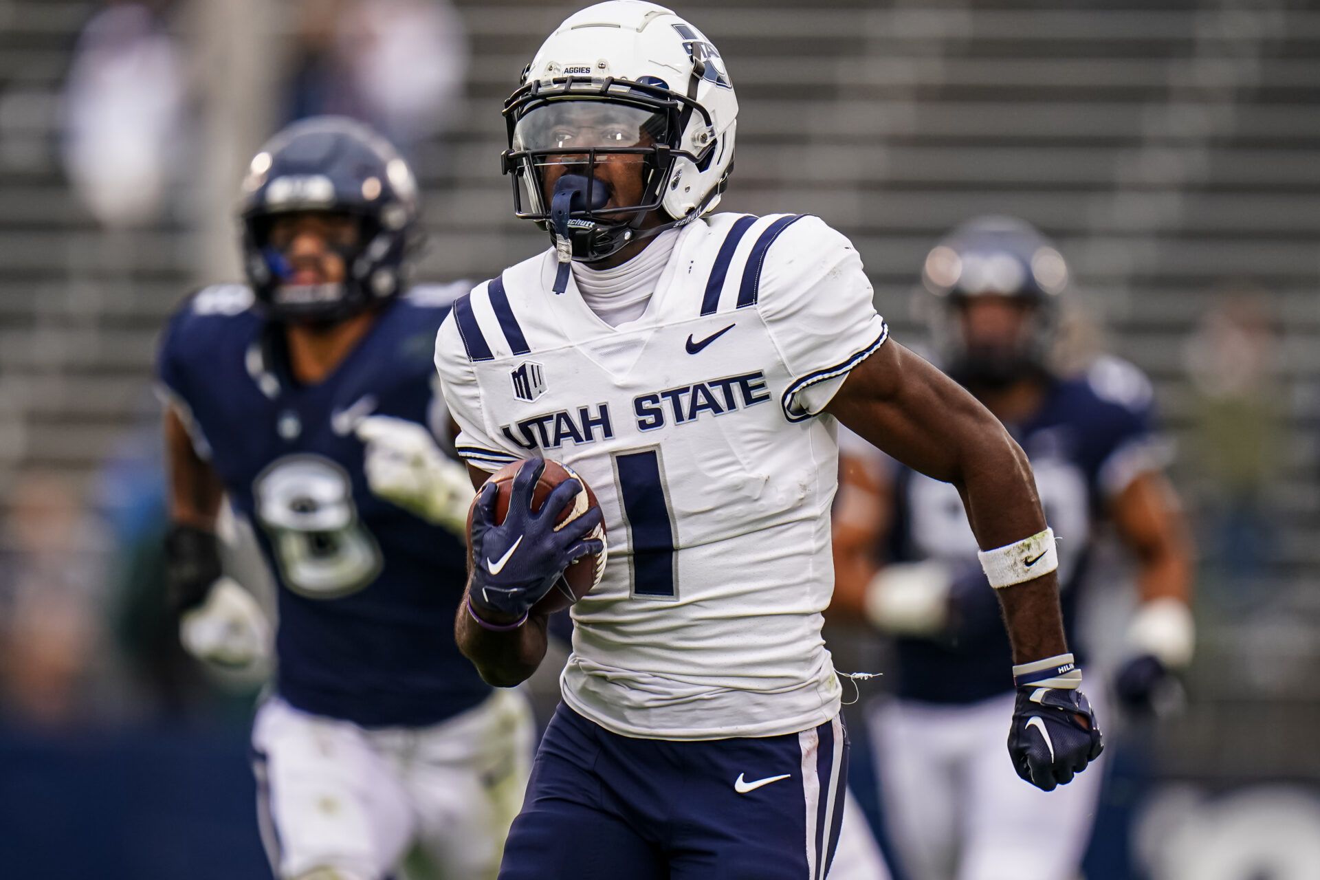 2025 NFL Draft prospect and former Utah State wide receiver Jalen Royals runs after catching a pass against UConn.