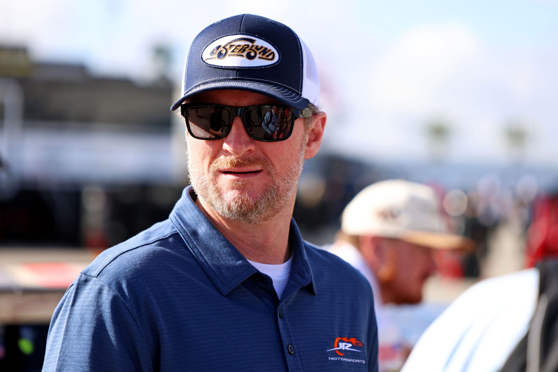 Feb 12, 2025; Daytona Beach, Florida, USA; NASCAR team owner Dale Earnhardt Jr. looks on during practice for the Daytona 500 at Daytona International Speedway. Mandatory Credit: Peter Casey-Imagn Images