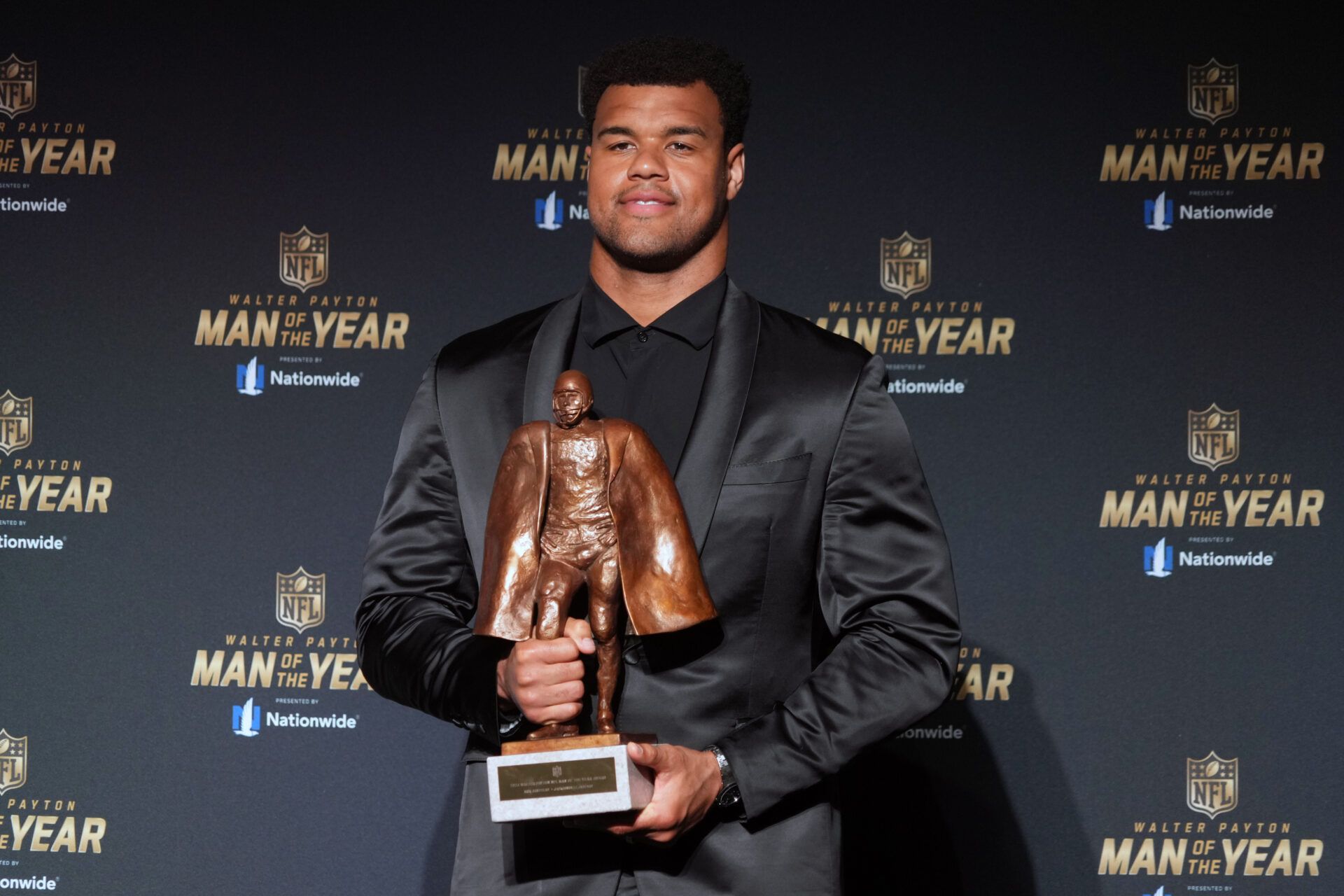 Feb 6, 2025; New Orleans, LA, USA; Jacksonville Jaguars defensive end Arik Armstead poses with the Walter Payton Man of the Year award during Super Bowl LIX NFL Honors at Saenger Theatre. Mandatory Credit: Kirby Lee-Imagn Images