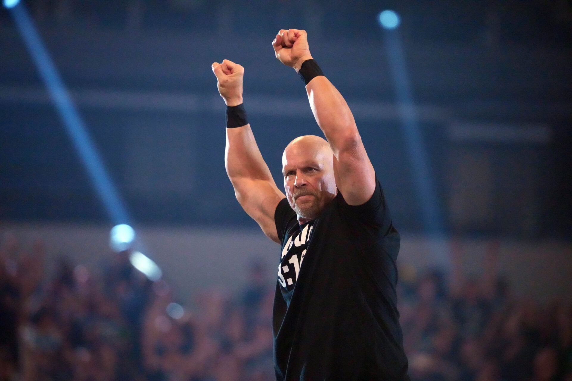Apr 2, 2022; Arlington, TX, USA; Stone Cold Steve Austin enters the arena during WrestleMania at AT&T Stadium. Mandatory Credit: Joe Camporeale-USA TODAY Sports