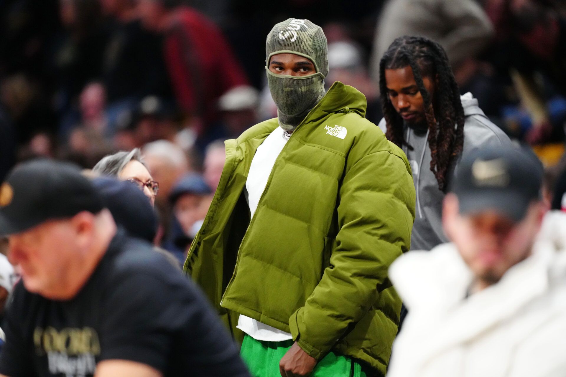 Feb 15, 2025; Boulder, Colorado, USA; American football quarterback Shedeur Sanders leaves the CU Events Center during the second half between the UCF Knights against the Colorado Buffaloes. Mandatory Credit: Ron Chenoy-Imagn Images