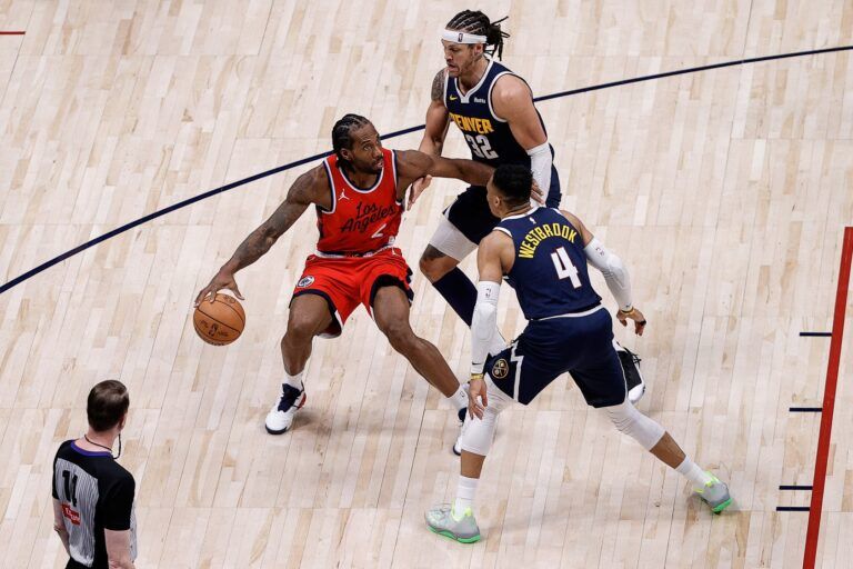 Los Angeles Clippers forward Kawhi Leonard (2) controls the ball as Denver Nuggets forward Aaron Gordon (32) and guard Russell Westbrook (4) guards in the fourth quarter during game two of first round for the 2025 NBA Playoffs at Ball Arena.