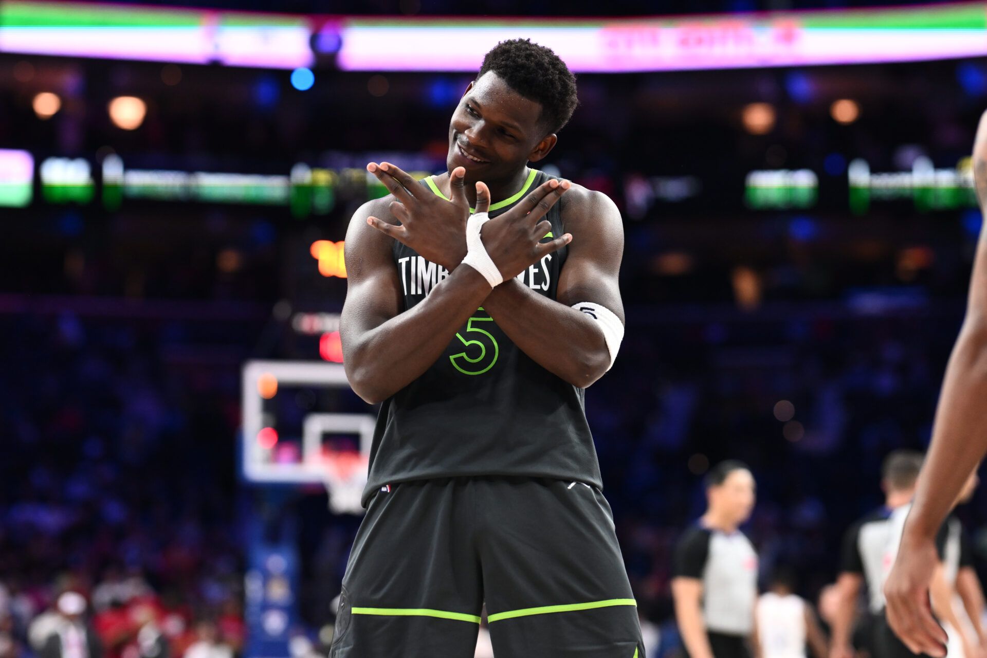 Minnesota Timberwolves guard Anthony Edwards (5) reacts after scoring against the Philadelphia 76ers in the fourth quarter at Wells Fargo Center.