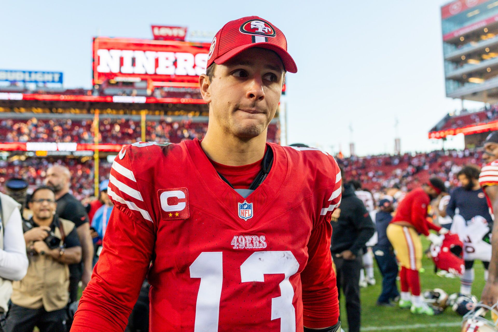 Dec 8, 2024; Santa Clara, California, USA; San Francisco 49ers quarterback Brock Purdy (13) looks on after the game against the Chicago Bears at Levi's Stadium. Mandatory Credit: Bob Kupbens-Imagn Images