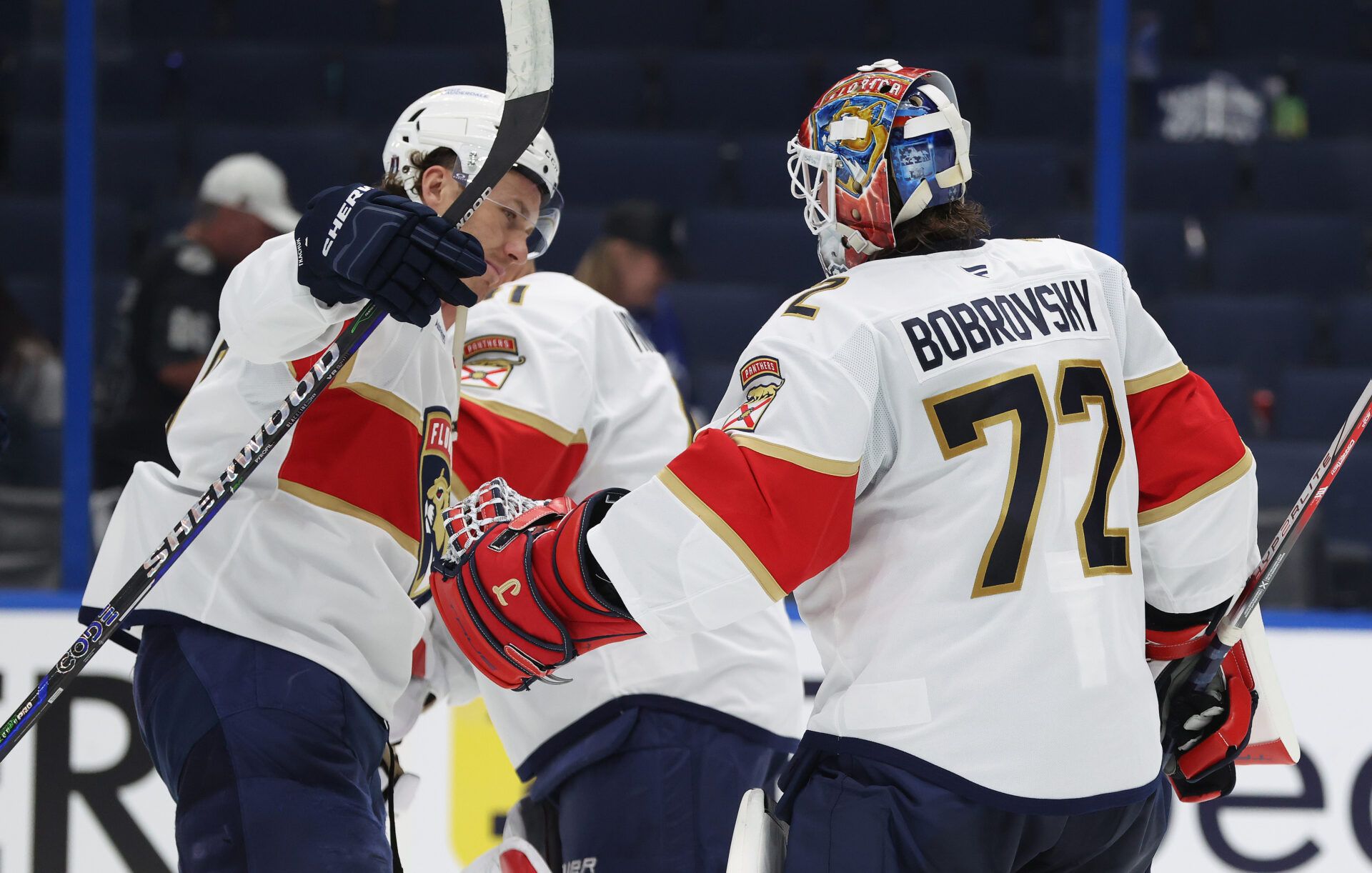 Apr 22, 2025; Tampa, Florida, USA; Florida Panthers goaltender Sergei Bobrovsky (72) and left wing Matthew Tkachuk (19) celebrate after they beat the Tampa Bay Lightning in game one of the first round of the 2025 Stanley Cup Playoffs at Amalie Arena. Mandatory Credit: Kim Klement Neitzel-Imagn Images