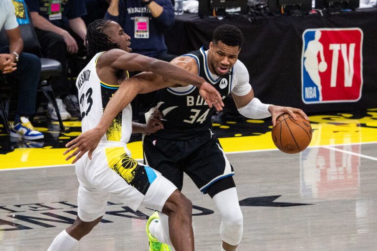 Apr 22, 2025; Indianapolis, Indiana, USA; Milwaukee Bucks forward Giannis Antetokounmpo (34) dribbles the ball while Indiana Pacers forward Aaron Nesmith (23) defends during game two of first round for the 2024 NBA Playoffs at Gainbridge Fieldhouse. Mandatory Credit: Trevor Ruszkowski-Imagn Images