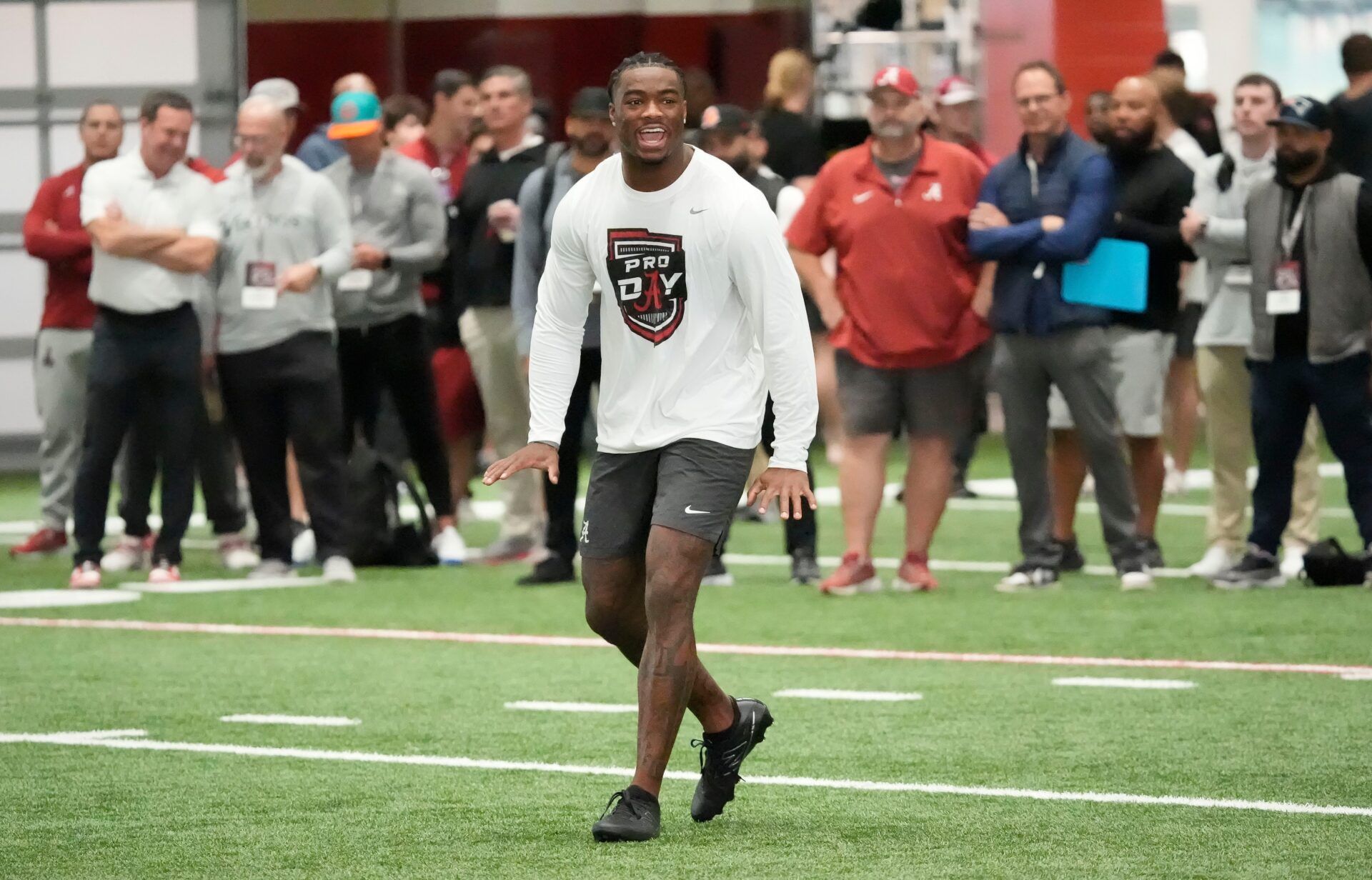 Mar 19, 2025; Tuscaloosa AL, USA; Quarterback Jalen Milroe calls a play as he throws for scouts at the University of Alabama Pro Day as several Crimson Tide players worked out for NFL teams in the Hank Crisp Indoor Practice Facility.