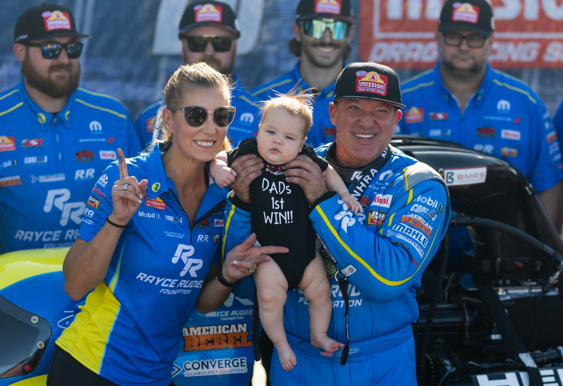 Apr 13, 2025; Las Vegas, NV, USA; NHRA top fuel driver Tony Stewart celebrates with wife Leah Pruett and son Dominic Stewart after winning the Four Wide Nationals at The Strip at Las Vegas Motor Speedway. The win is the first of Stewarts professional drag racing career. Mandatory Credit: Mark J. Rebilas-Imagn Images