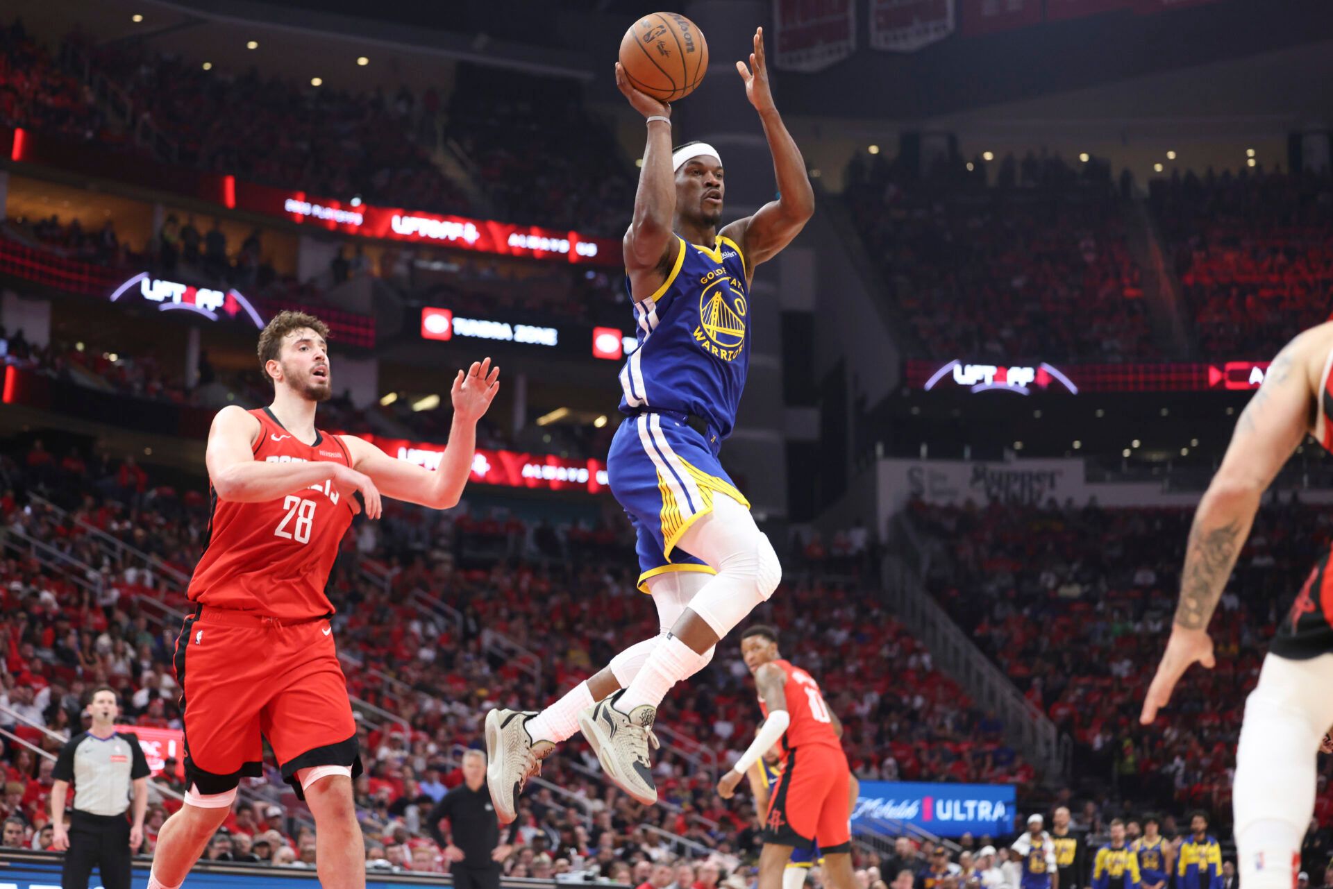 Golden State Warriors forward Jimmy Butler III (10) passes the ball during the second quarter against the Houston Rockets at Toyota Center.