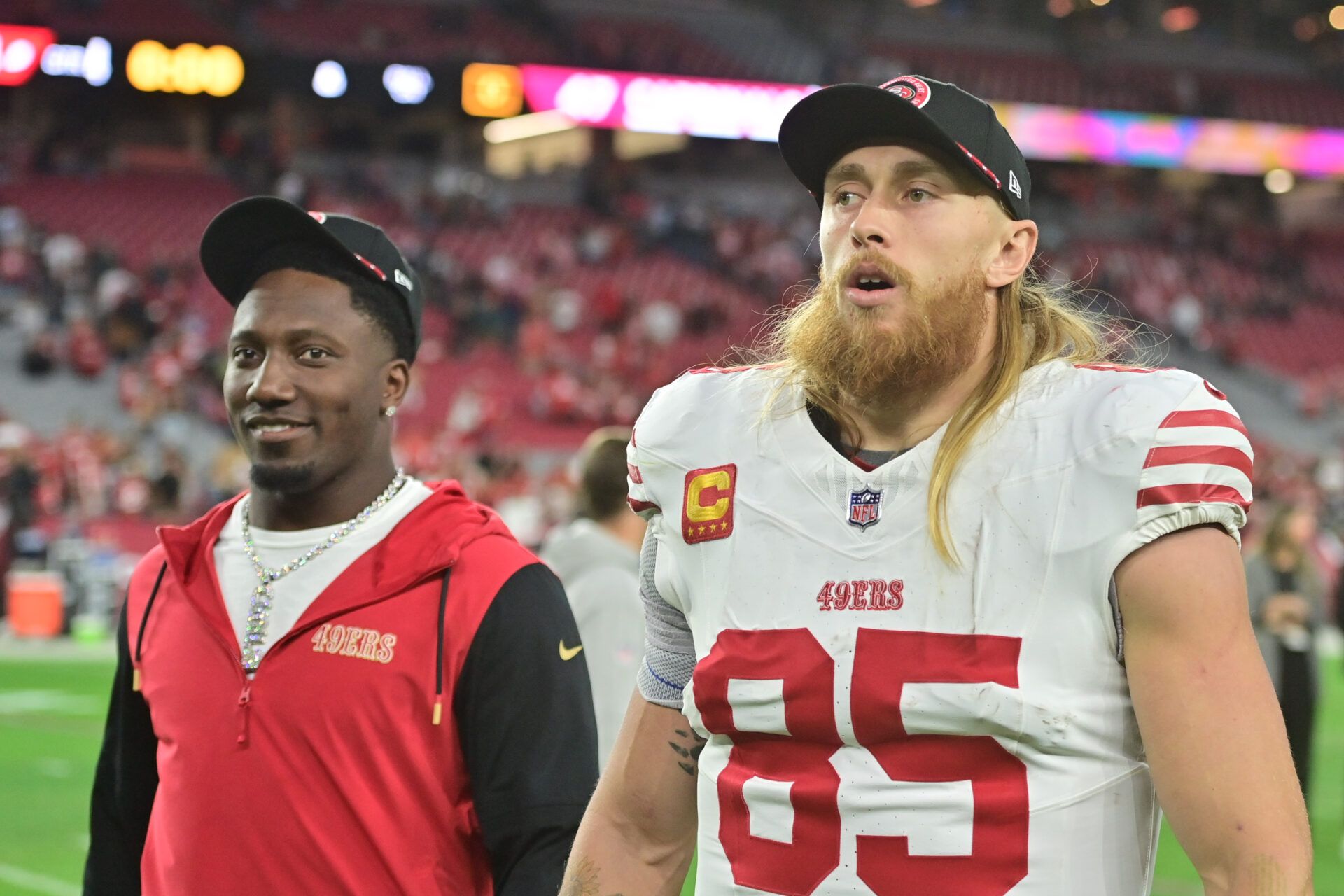 Jan 5, 2025; Glendale, Arizona, USA; San Francisco 49ers tight end George Kittle (85) and wide receiver Deebo Samuel Sr. (1) look on after losing to the Arizona Cardinals at State Farm Stadium. Mandatory Credit: Matt Kartozian-Imagn Images