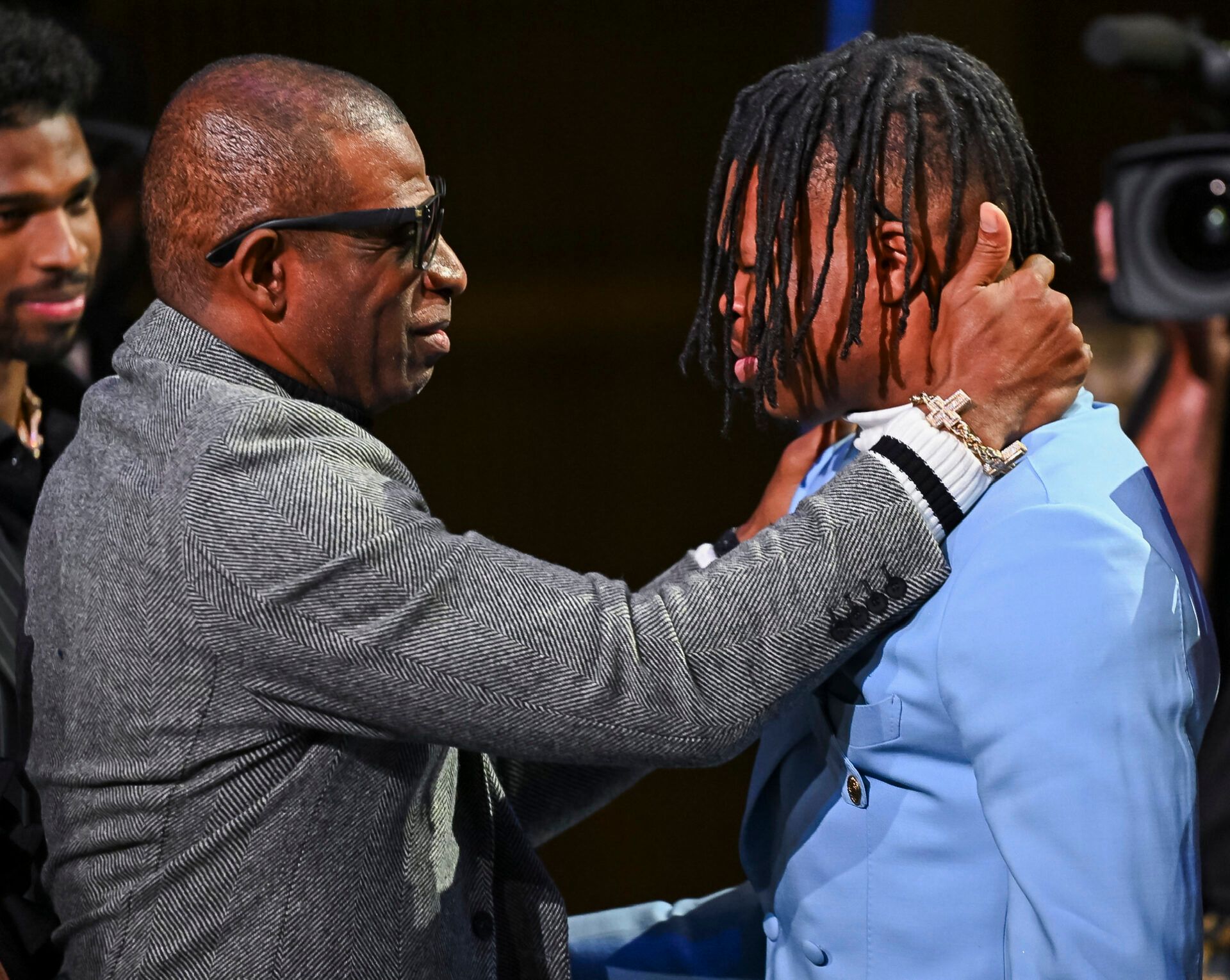 Dec 14, 2024; New York, NY, USA; Colorado Buffaloes wide receiver/cornerback Travis Hunter with head coach Deion Sanders after winning the 2024 Heisman Trophy. Mandatory Credit: Todd Van Emst/Heisman Trust via Imagn Images