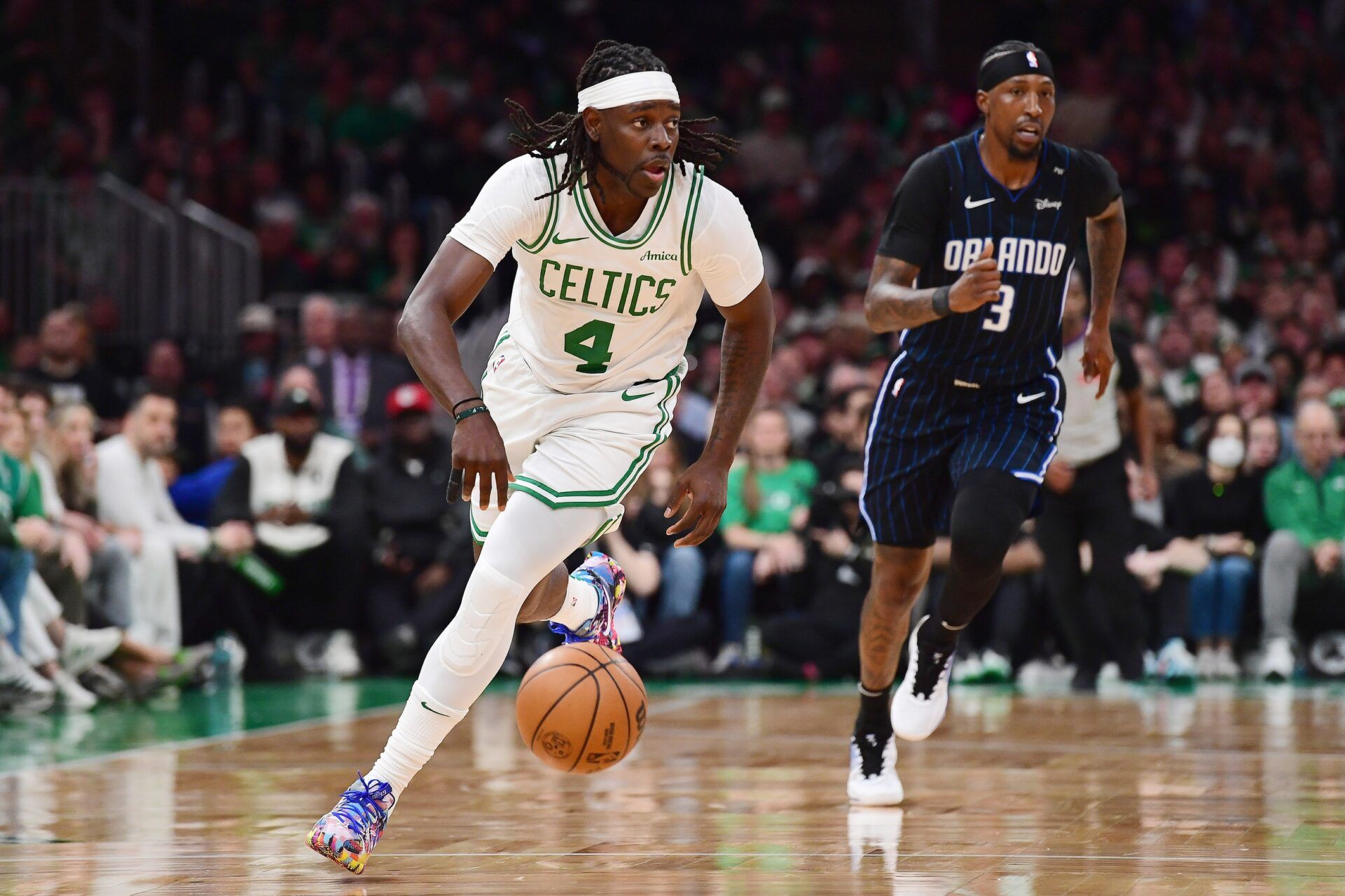 Boston Celtics guard Jrue Holiday (4) controls the ball during the second half against the Orlando Magic at TD Garden.