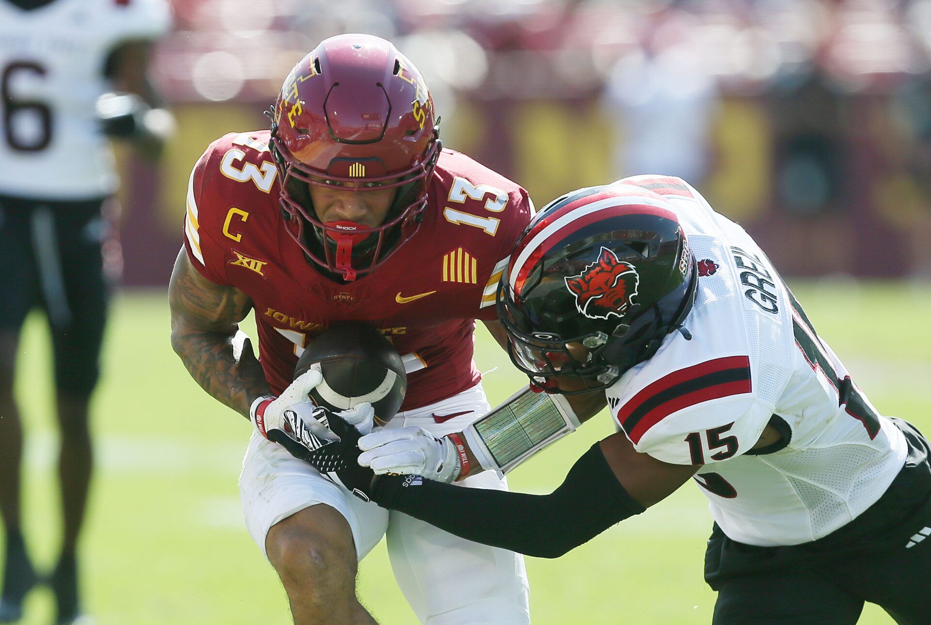 Iowa State Cyclones wide receiver Jaylin Noel (13) battle for few yards as getting a tackle Arkansas State Red Wolves safety Brandon Greil (15) after making a catch during the second quarter in the week-4 NCAA football at Jack Trice Stadium on Saturday, Sept. 21, 2024, in Ames, Iowa.
