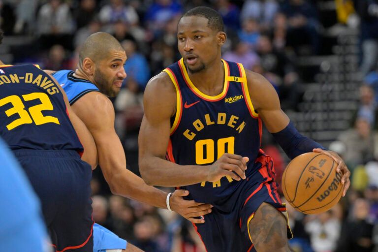Dec 27, 2024; Inglewood, California, USA; Golden State Warriors forward Jonathan Kuminga (00) drives around Los Angeles Clippers forward Nicolas Batum (33) in the second half at Intuit Dome. Mandatory Credit: Jayne Kamin-Oncea-Imagn Images