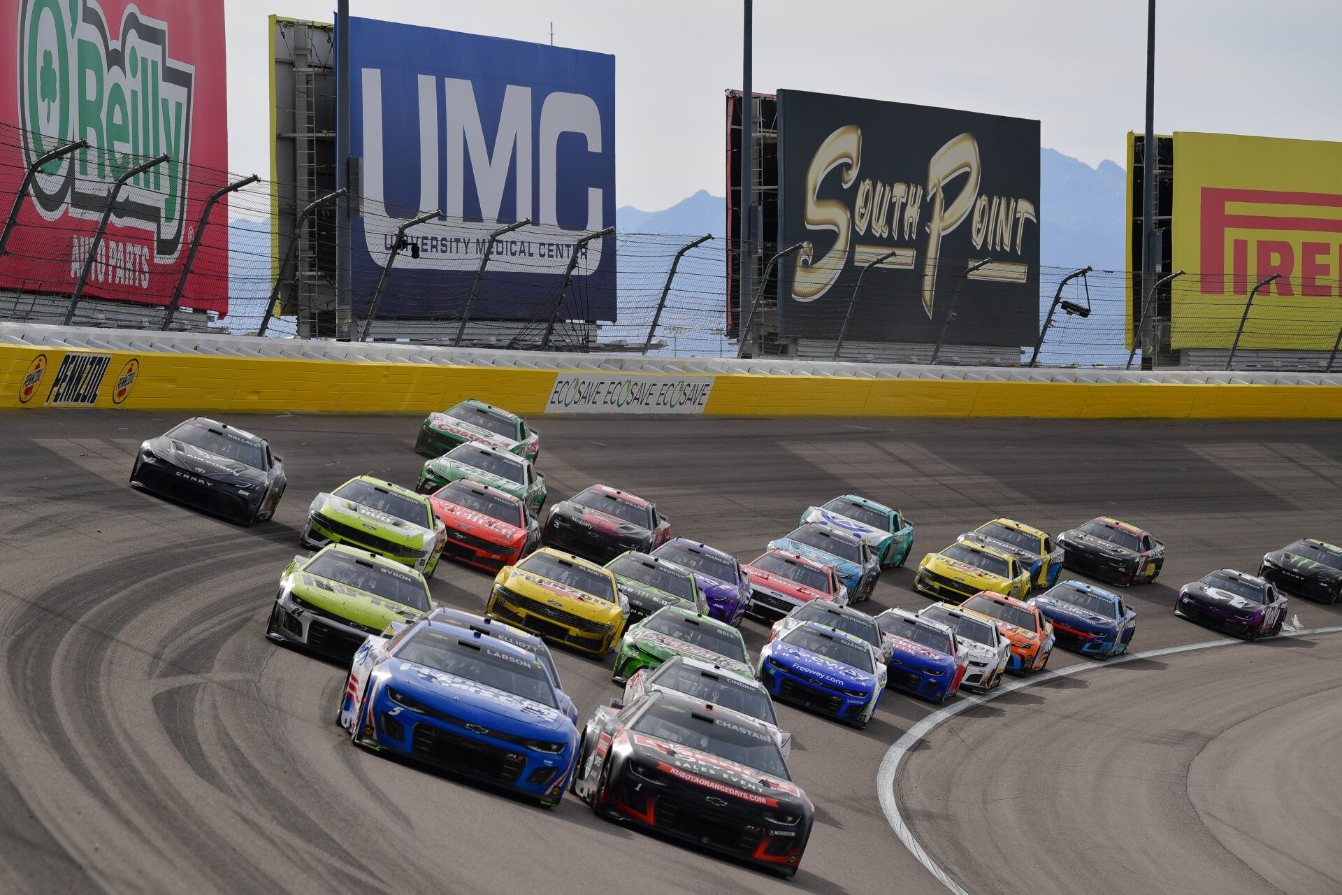 Mar 16, 2025; Las Vegas, Nevada, USA; NASCAR Cup Series driver Kyle Larson (5) and driver Ross Chastain (1) lead the field for the restart during the Pennzoil 400 at Las Vegas Motor Speedway. Mandatory Credit: Gary A. Vasquez-Imagn Images