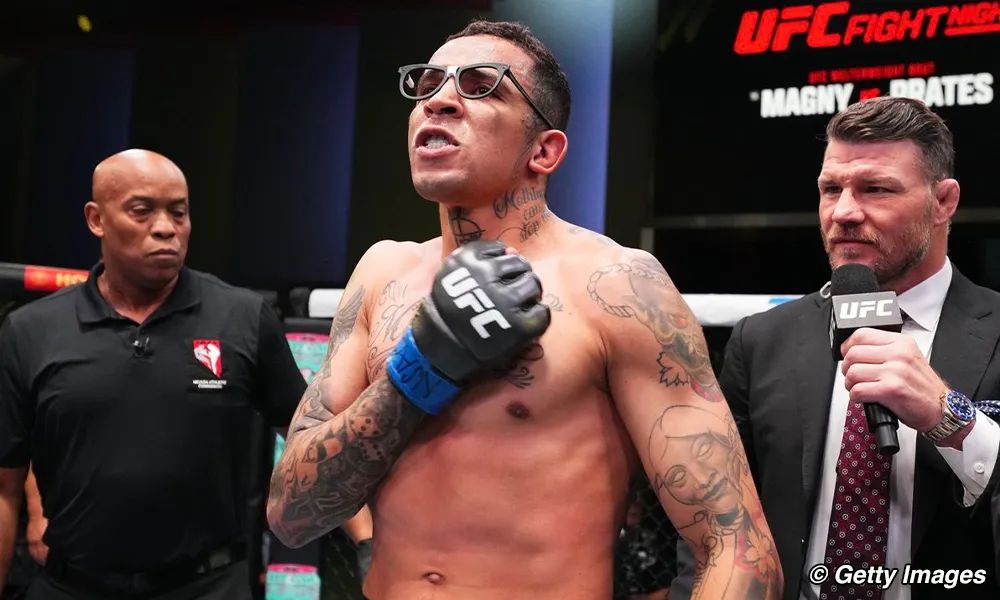 Carlos Prates receives advice from mother for Ian Machado Garry (Image source: USA Today]