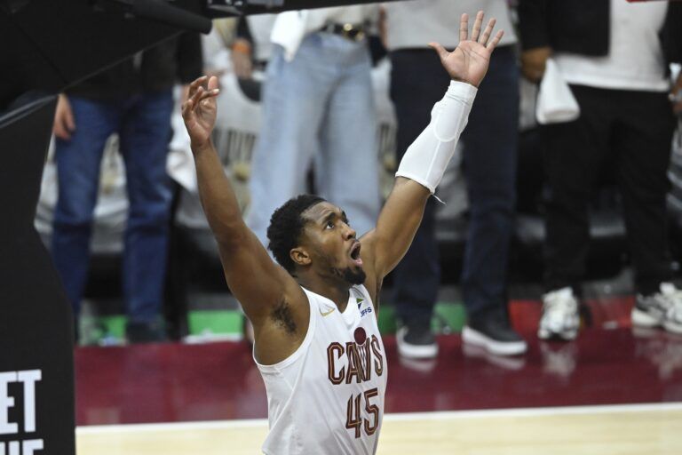 Apr 23, 2025; Cleveland, Ohio, USA; Cleveland Cavaliers guard Donovan Mitchell (45) reacts in the fourth quarter of game two of the first round of the 2025 NBA Playoffs against the Miami Heat at Rocket Arena. Mandatory Credit: David Richard-Imagn Images