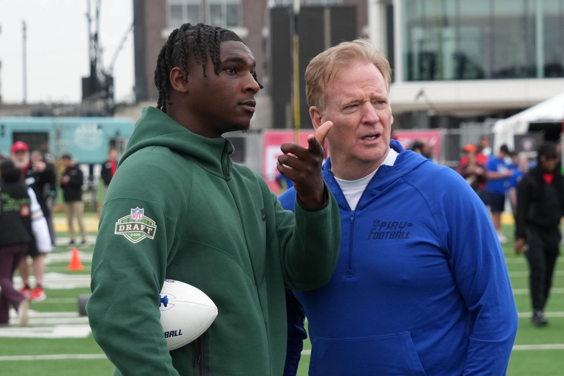Apr 23, 2025; Green Bay, WI, USA; NFL commissioner Roger Goodell (right) talks with Miami Hurricanes quarterback Cam Ward aka Cameron Ward during the NFL Draft prospect clinic with Special Olympics at Draft Experience Field at Titletown. Mandatory Credit: Kirby Lee-Imagn Images