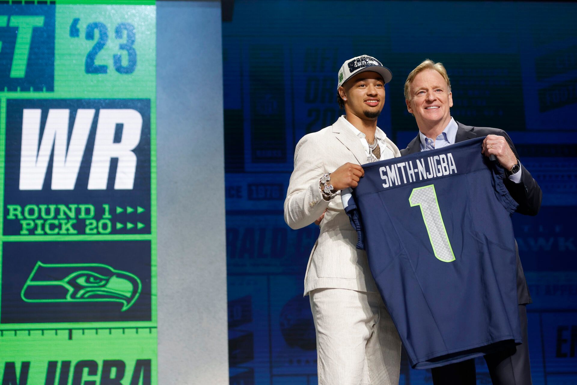 KANSAS CITY, MISSOURI - APRIL 27: (L-R) Jaxon Smith-Njigba poses with NFL Commissioner Roger Goodell after being selected 20th overall by the Seattle Seahawks during the first round of the 2023 NFL Draft at Union Station on April 27, 2023 in Kansas City, Missouri. (Photo by David Eulitt/Getty Images)
