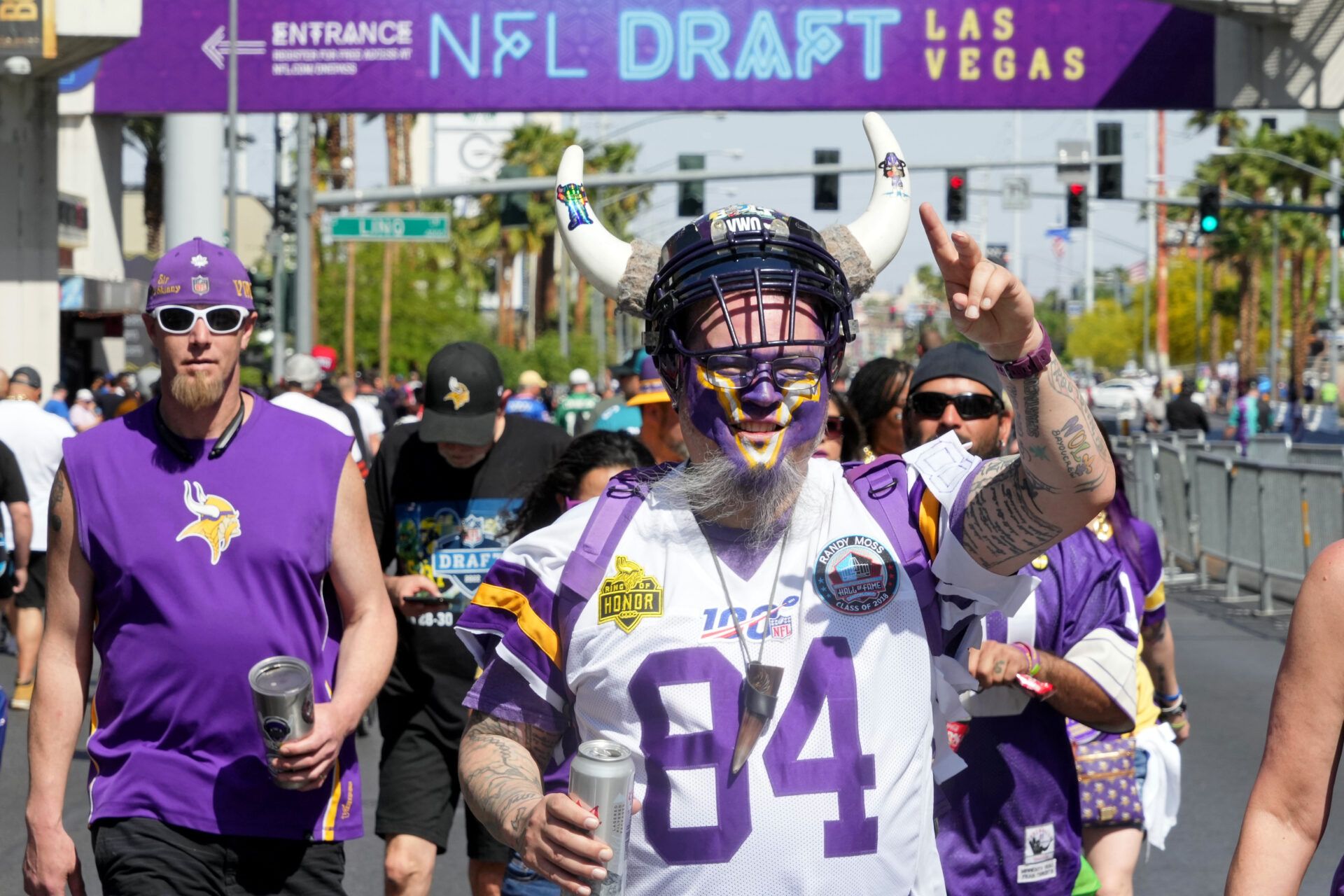 Apr 28, 2022; Las Vegas, NV, USA; A Minnesota Vikings fan gestures while walking on Las Vegas Boulevard before the first round of the 2022 NFL Draft. Mandatory Credit: Kirby Lee-USA TODAY Sports