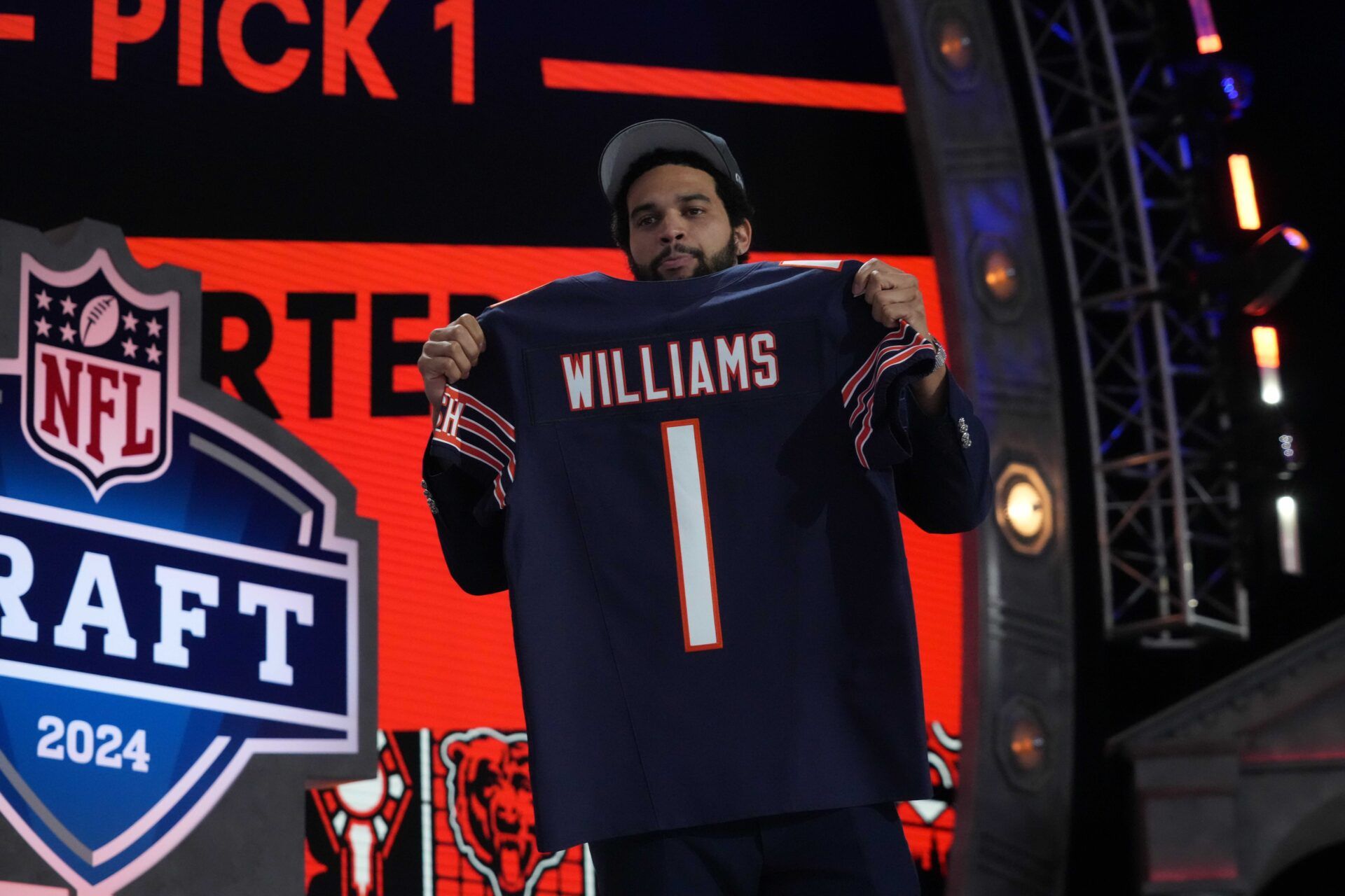 Southern California Trojans quarterback Caleb Williams poses with jersey after being chosen as the No. 1 pick in the first round during the 2024 NFL Draft at Campus Martius Park and Hart Plaza.