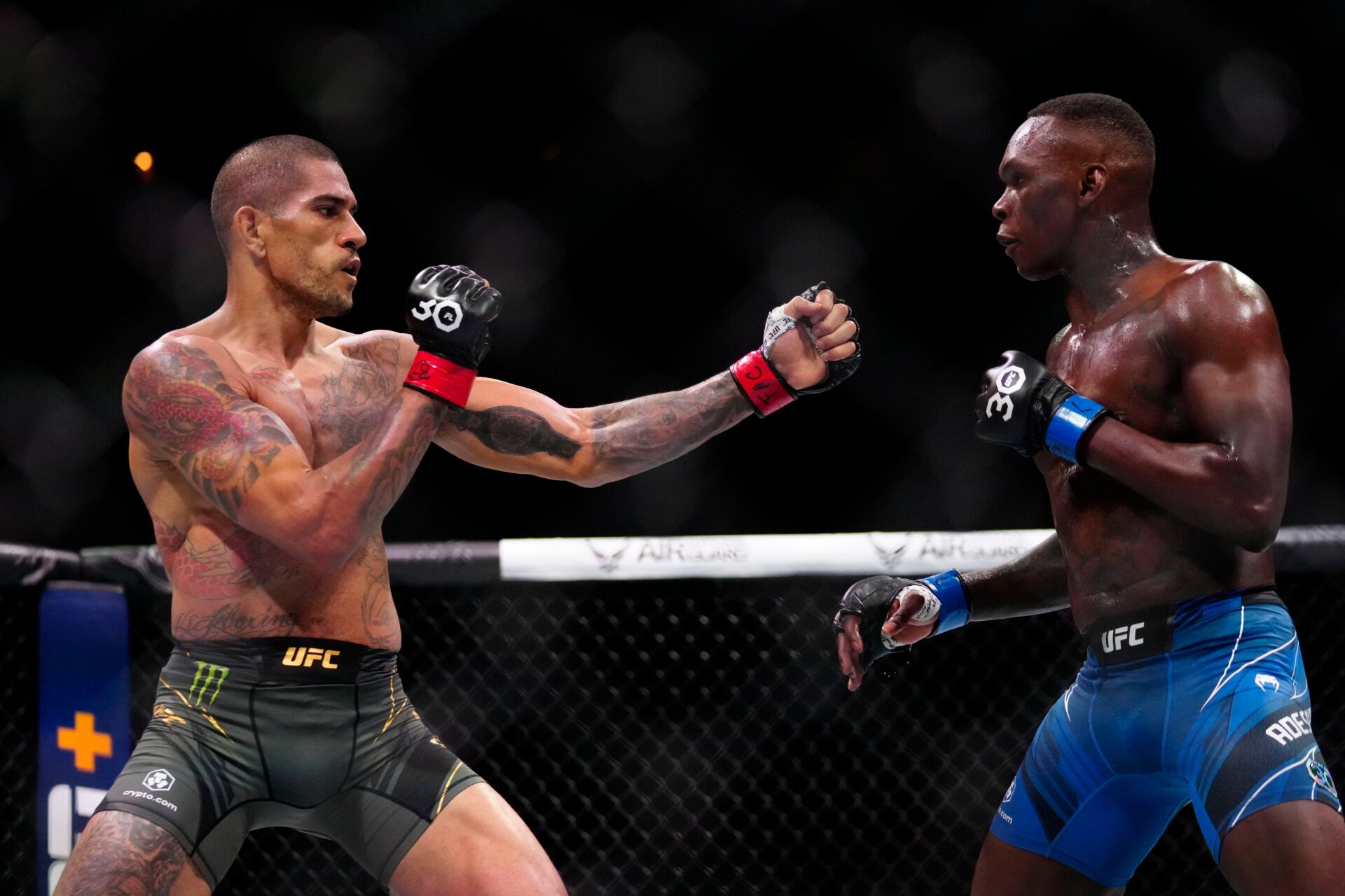 Apr 8, 2023; Miami, Florida, USA; Alex Pereira (red gloves) fights Israel Adesanya (blue gloves) during UFC 287 at Miami-Dade Arena. Mandatory Credit: Rich Storry-USA TODAY Sports