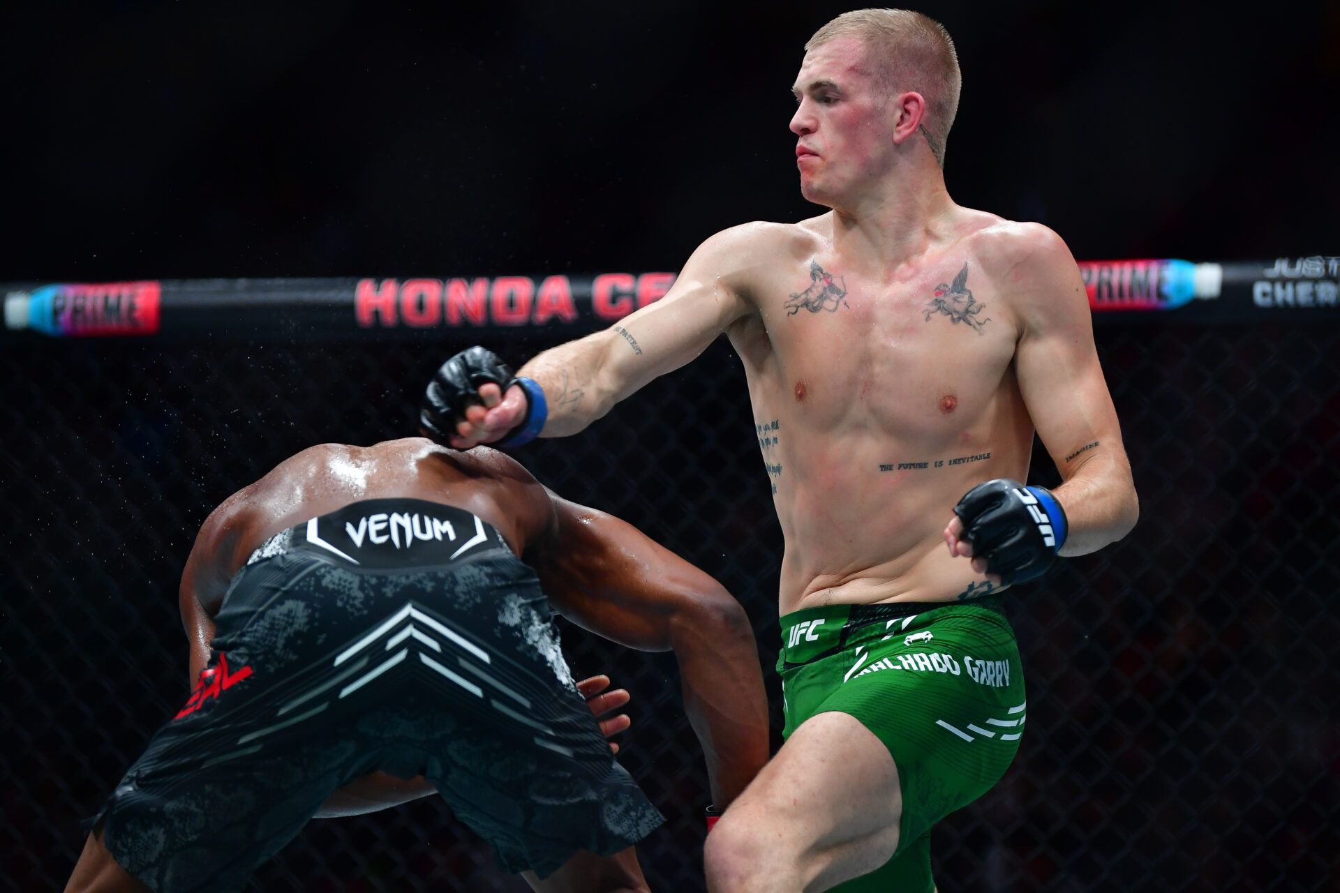 Feb 17, 2024; Anaheim, California, USA; Ian Machado Garry moves in for a hit against Geoff Neal during UFC 298 at Honda Center. Mandatory Credit: Gary A. Vasquez-USA TODAY Sports