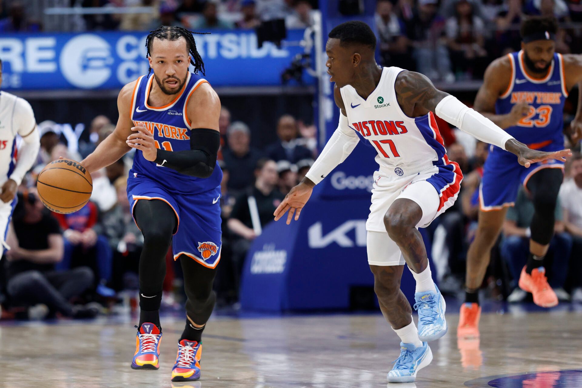 Apr 24, 2025; Detroit, Michigan, USA; New York Knicks guard Jalen Brunson (11) dribbles defended by Detroit Pistons guard Dennis Schroder (17) in the first half during game three of first round for the 2024 NBA Playoffs at Little Caesars Arena. Mandatory Credit: Rick Osentoski-Imagn Images