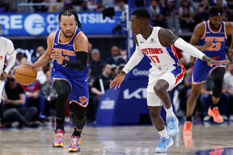 Apr 24, 2025; Detroit, Michigan, USA; New York Knicks guard Jalen Brunson (11) dribbles defended by Detroit Pistons guard Dennis Schroder (17) in the first half during game three of first round for the 2024 NBA Playoffs at Little Caesars Arena. Mandatory Credit: Rick Osentoski-Imagn Images