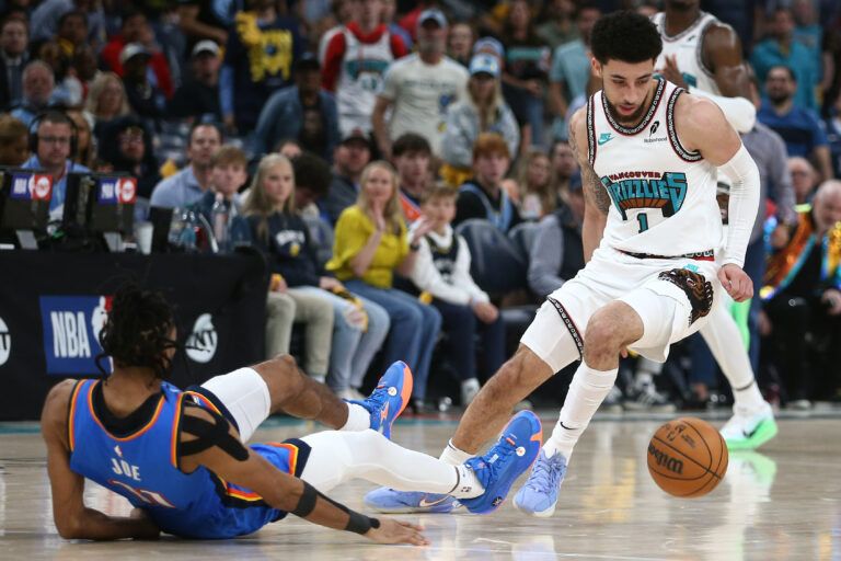 Apr 24, 2025; Memphis, Tennessee, USA; Memphis Grizzlies guard Scotty Pippen Jr. (1) crosses over Oklahoma City Thunder guard Isaiah Joe (11) during the second quarter during game three for the first round of the 2024 NBA Playoffs at FedExForum. Mandatory Credit: Petre Thomas-Imagn Images