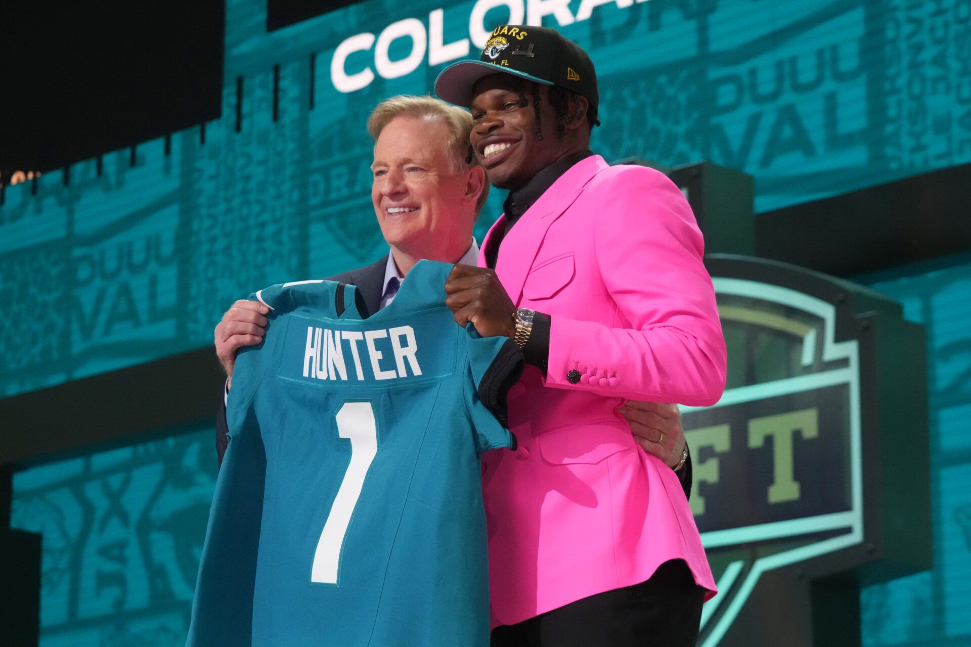 Apr 24, 2025; Green Bay, WI, USA; NFL commissioner Roger Goodell stands with Colorado Buffaloes wide receiver Travis Hunter after he is selected by the Jacksonville Jaguars as the number two pick in the first round of the 2025 NFL Draft at Lambeau Field. Mandatory Credit: Kirby Lee-Imagn Images
