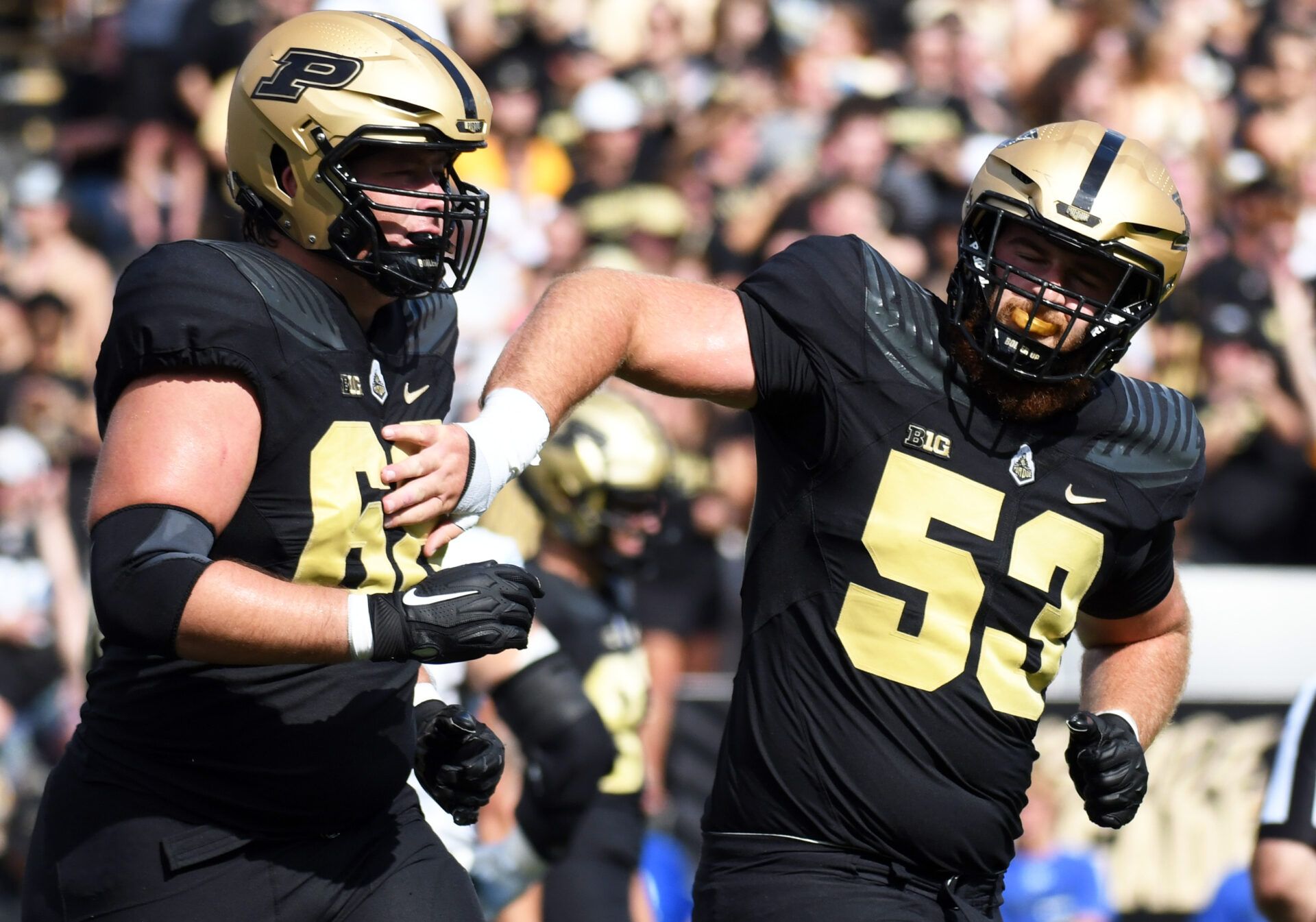Sep 10, 2022; West Lafayette, Indiana, USA; Purdue Boilermakers offensive lineman Gus Hartwig (53) celebrates with Purdue Boilermakers offensive lineman Marcus Mbow (63) after a touchdown during the first quarter against Indiana State Sycamores at Ross-Ade Stadium. Mandatory Credit: Robert Goddin-USA TODAY Sports