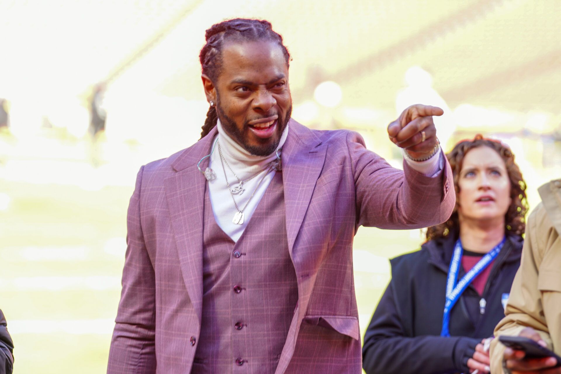 Nov 29, 2024; Kansas City, Missouri, USA; Commentator Richard Sherman signals to fans prior to a game between the Kansas City Chiefs and Las Vegas Raiders at GEHA Field at Arrowhead Stadium. Mandatory Credit: Denny Medley-Imagn Images