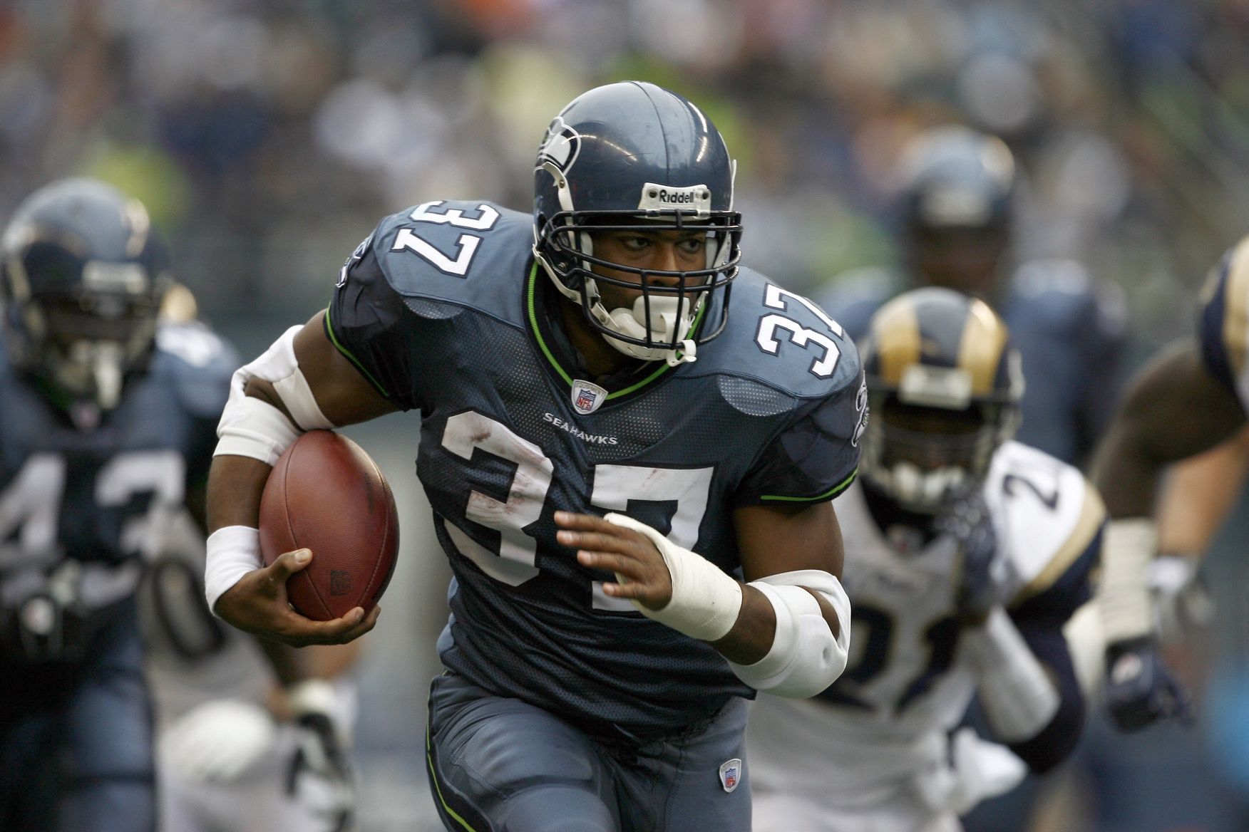 Seattle Seahawks running back Shaun Alexander (37) rushes against the St. Louis Rams in the second quarter at Qwest Field.