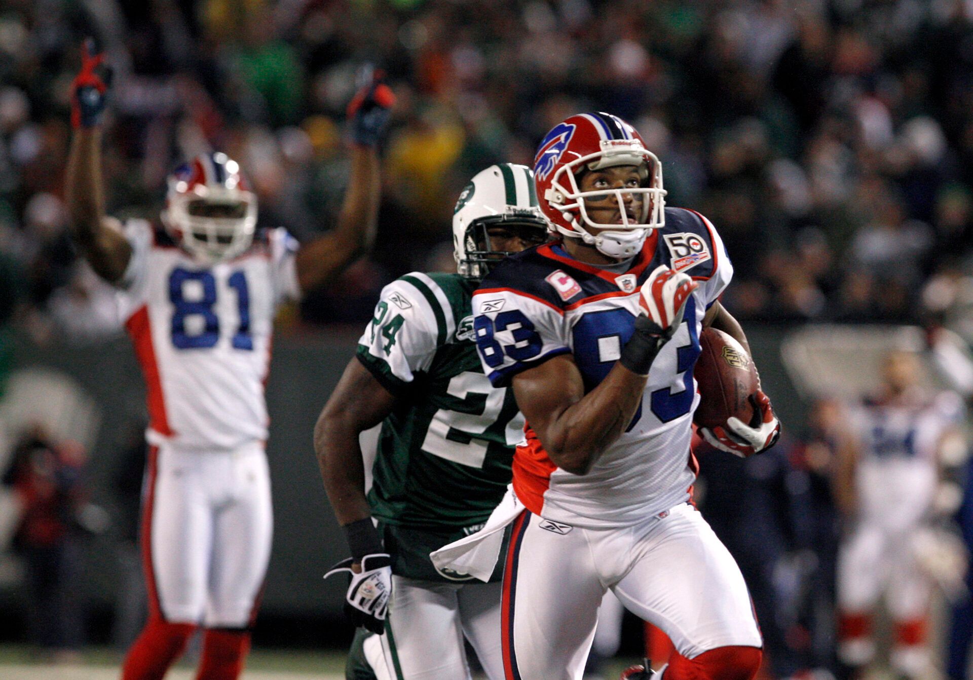 Oct 18, 2009; East Rutherford, NJ, USA; Buffalo Bills wide receiver Lee Evans (83) breaks free from New York Jets cornerback Darrelle Revis (24) for a touchdown during the second half at Giants Stadium. The Bills defeated the Jets 16-13 in overtime. Mandatory Credit: Ed Mulholland-USA TODAY Sports