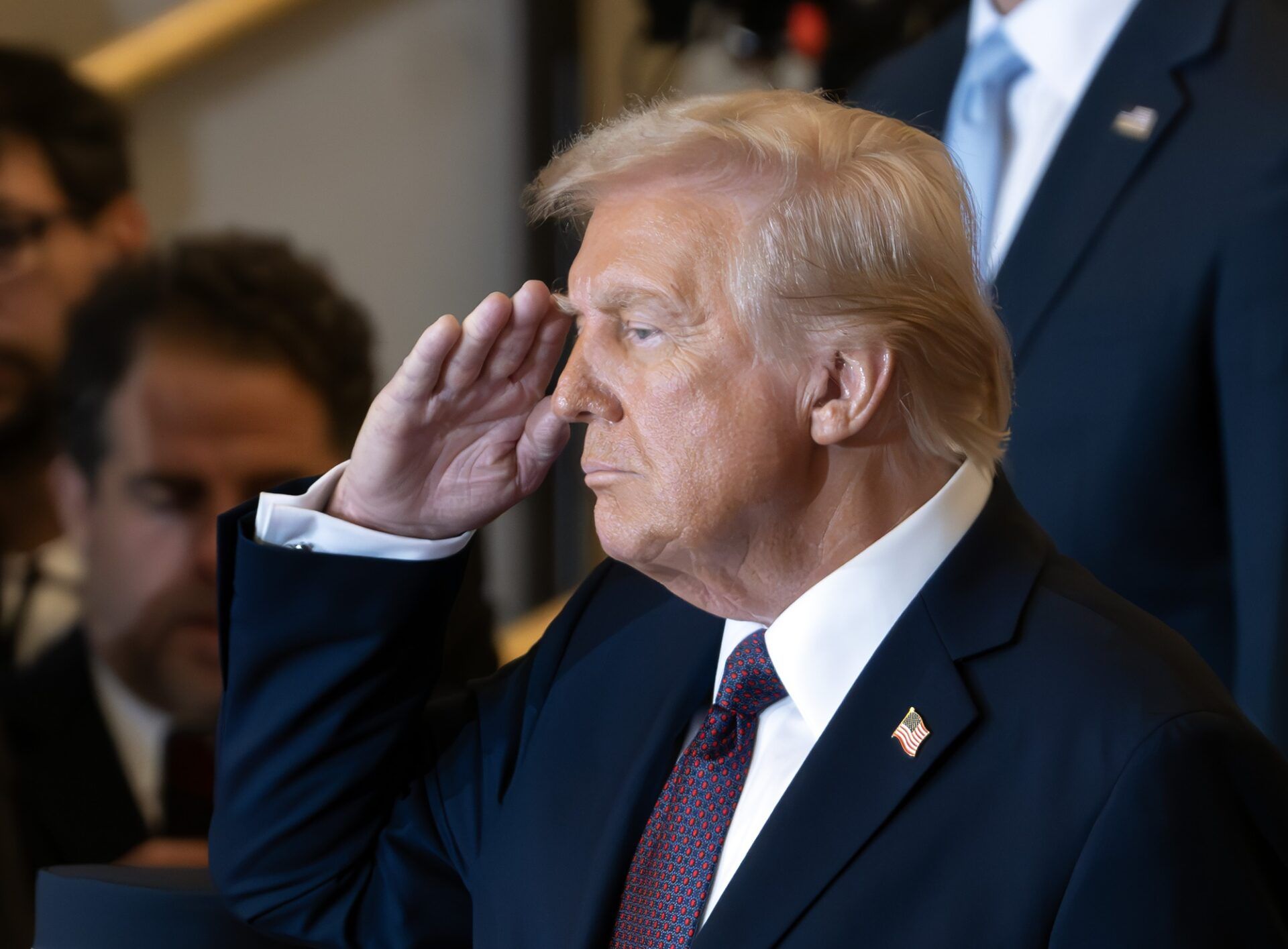 United States President Donald J Trump salutes as he participates in a Reviewing the Troops Ceremony as part of his Inaugural activities in Emancipation Hall in the United States Capitol in Washington, DC on January 20, 2025.