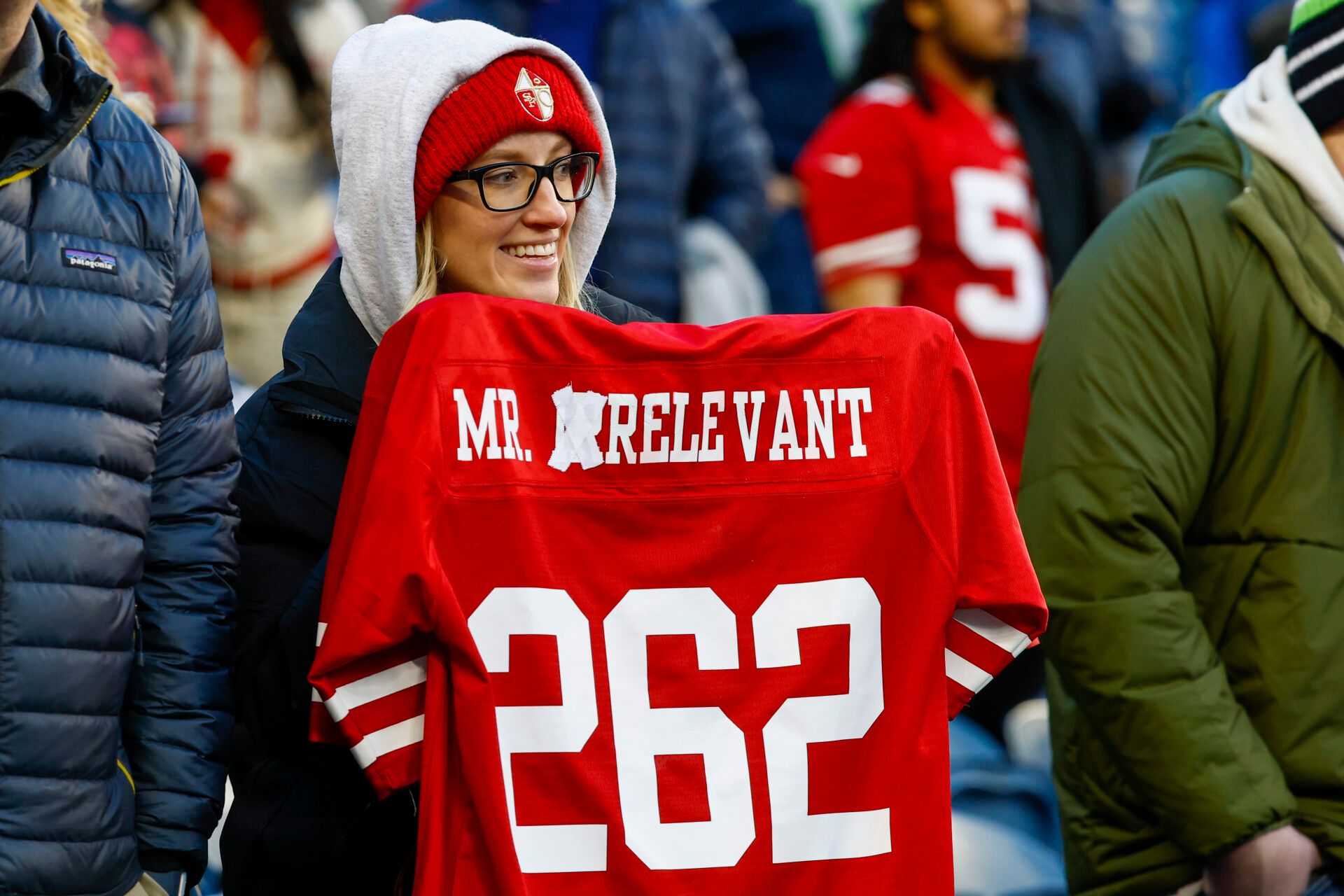 Dec 15, 2022; Seattle, Washington, USA; A fan holds an altered “Mr. Irrelevant” jersey for San Francisco 49ers quarterback Brock Purdy (not pictured) during pregame warmups against the Seattle Seahawks at Lumen Field. “Mr. Irrelevant” refers to the final pick of the NFL draft. Mandatory Credit: Joe Nicholson-USA TODAY Sports